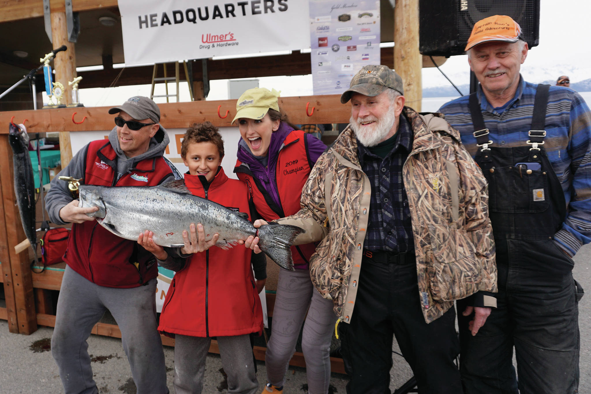 Andrew Marley, the 2021 Homer Winter King Salmon Tournament winner, second from left, is joined by previous winners on Saturday, April 17, 2021, on the Homer Spit in Homer, Alaska. From left to right are Mike Olson, 2015 winner, and no. 8 in 2021; Marley; Shana Perry, 2019 winner; Charlie Edwards, 2018 winner; and Ron Johnson, 2017 winner. (Photo by Michael Armstrong/Homer News)