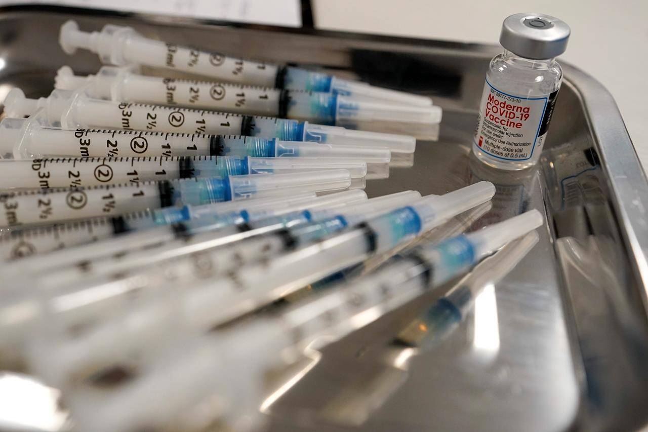 Thursday, March 18, 2021, file photo shows syringes filled with the Moderna COVID-19 vaccine at a pop up site in the Queens borough of New York. (AP Photo/Mary Altaffer)