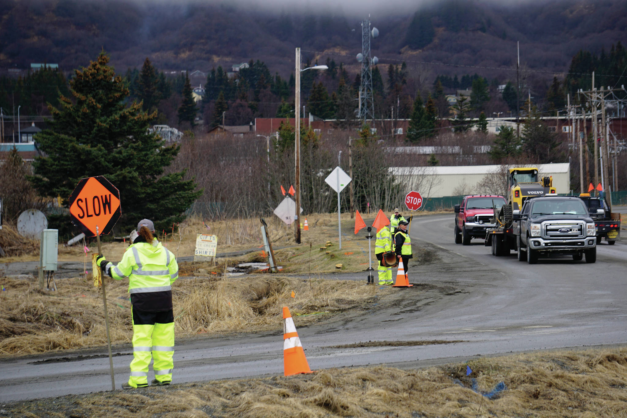 Flaggers control traffic on Friday, April 23, 2021, during preliminary construction work on Lake Street in Homer, Alaska. Rehabilitation work will be done on the street this spring and summer. (Photo by Michael Armstrong/Homer News)
