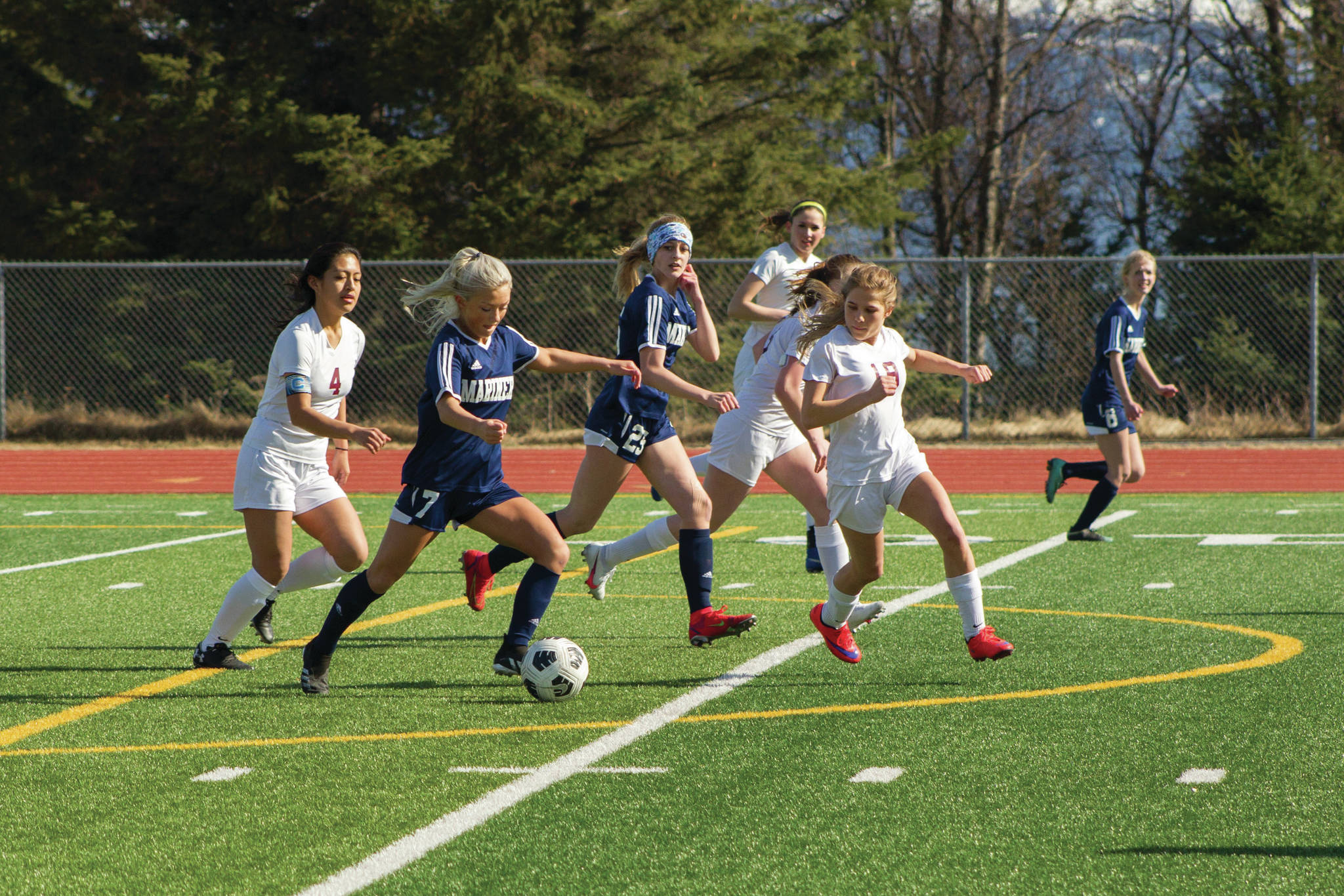 Lady Mariner’s Sela Weisser manuevers her way down field during the Homer girls vs. Grace Christian School soccer game April 30, 2021, at the Homer High School soccer field. (Photo by Sarah Knapp/Homer News)