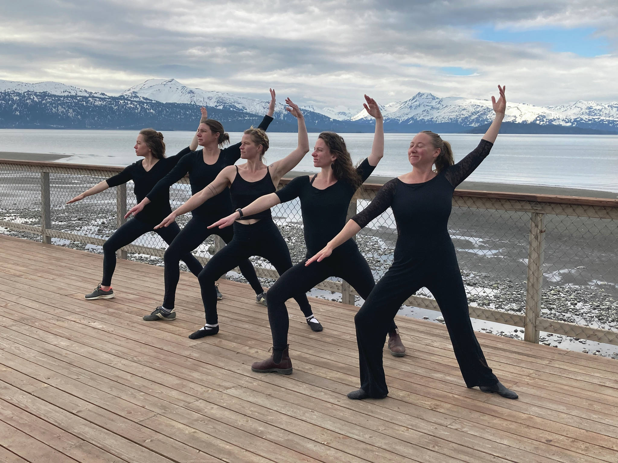 Members of the Motivity Dance Collective rehearse at the Kachemak Shellfish Growers Association deck in Homer, Alaska. From left to right, Emily Rogers, Emilie Springer, Bridget Doran, Rhoslyn Anderson, Breezy Berryman. Not pictured is Kammi Matson. (Photo by Kammi Matson)