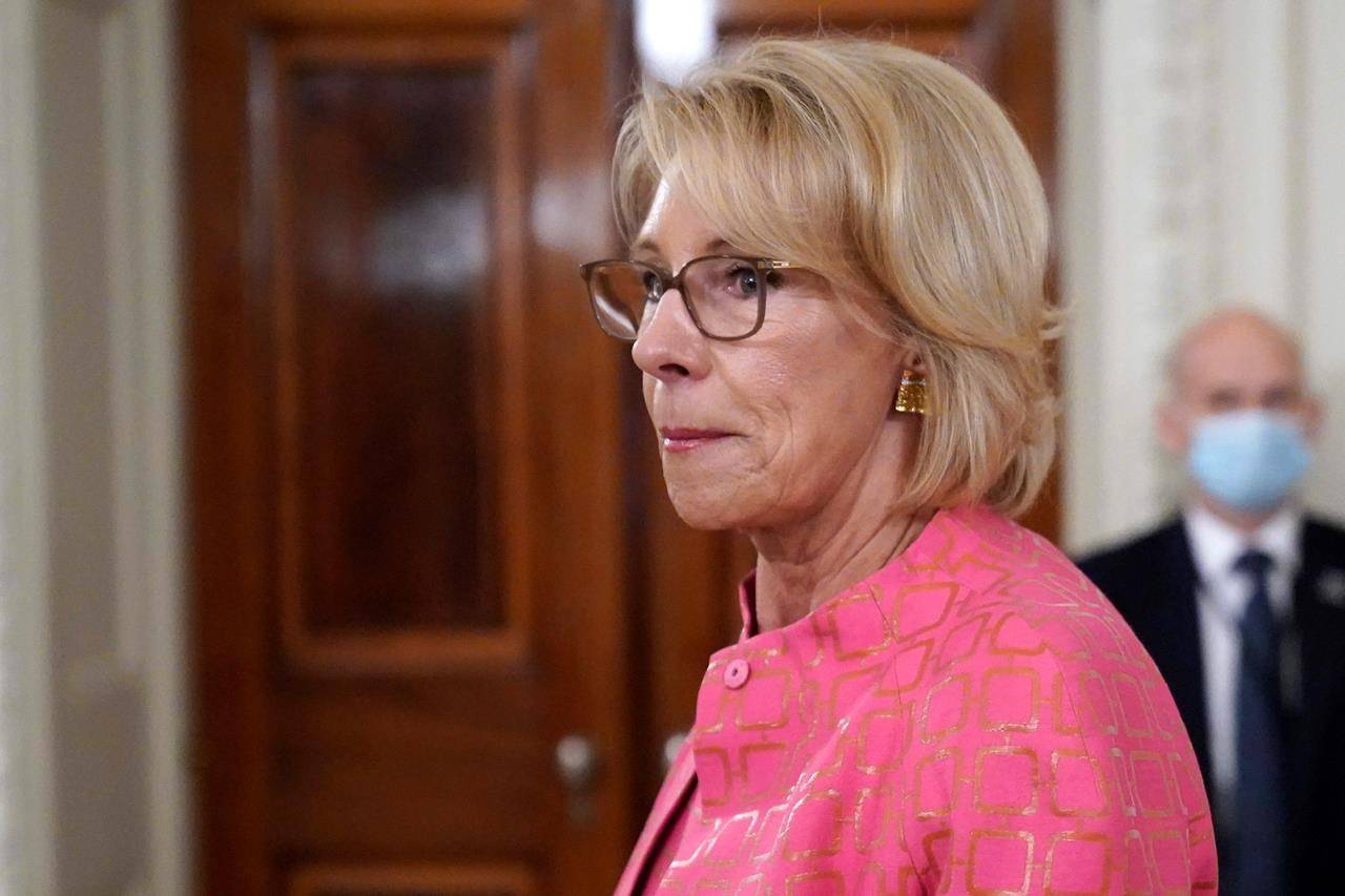 Education Secretary Betsy DeVos arrives for an event in the State Dining room of the White House, Wednesday, Aug. 12, 2020, in Washington. A federal judge allowed the Education Department to move forward with new rules governing how schools and universities respond to complaints of sexual assault. DeVos said the ruling is “yet another victory for students and reaffirms that students’ rights under Title IX go hand in hand with basic American principles of fairness and due process.” (AP Photo/Andrew Harnik, File)