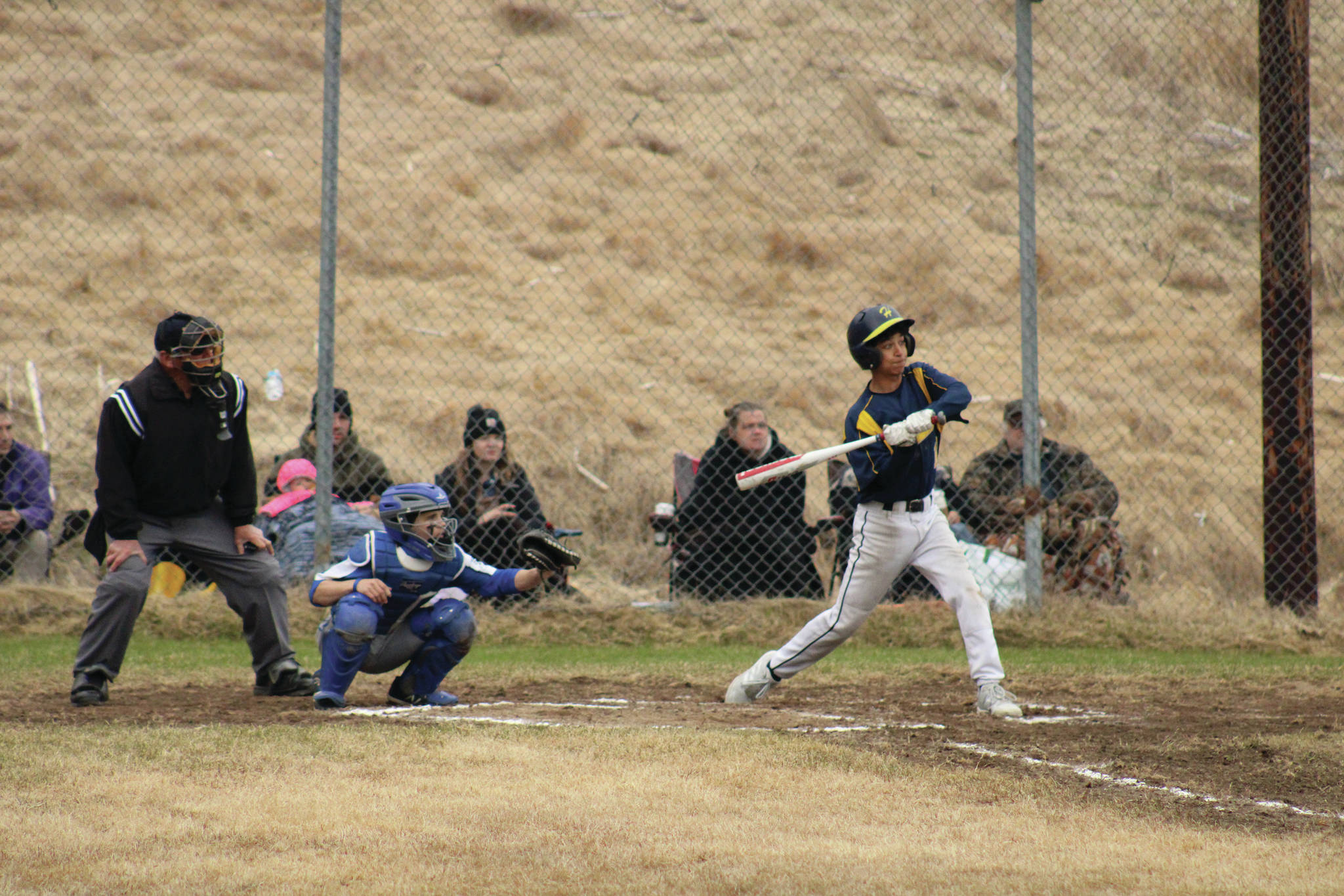 Homer second baseman Mylan Johnson swings at a pitch during a game against Palmer on Saturday, May 8, 2021, in Homer, Alaska. (Photo by Tim Rockey/Mat-Su Valley Frontiersman)