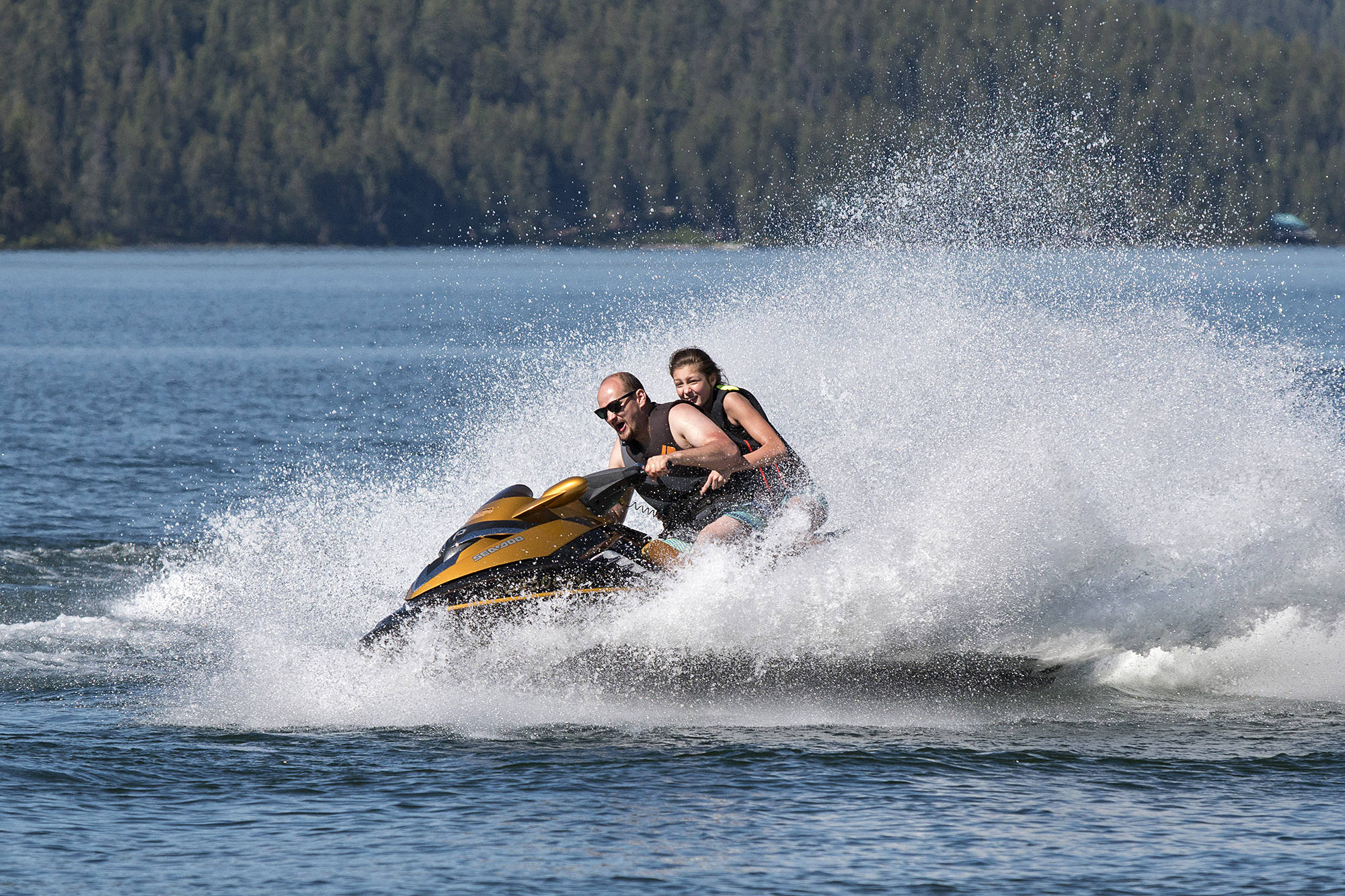 On Monday, the final day of the May long weekend, Harri Herter from Kamloops takes turns and gives friends thrilling jetski rides on little Shuswap Lake. - Image credit: Rick Koch photo.
