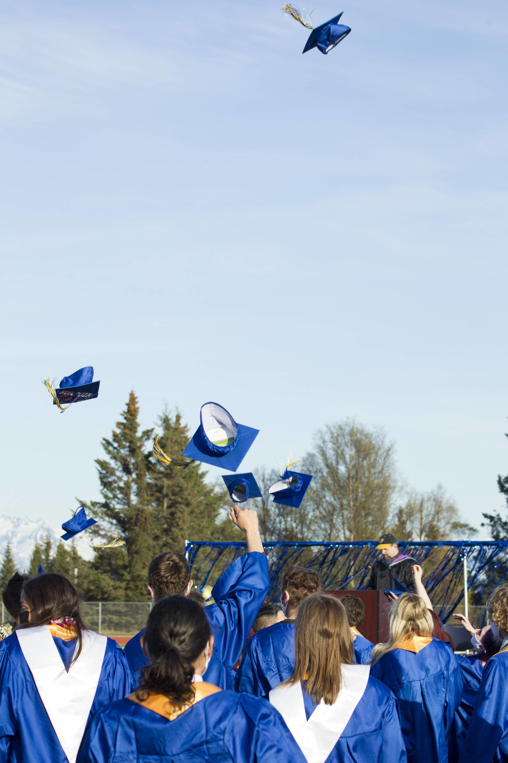 Homer High School graduates through their caps in the air after receiving their diplomas on May 18. (Photo by Sarah Knapp/Homer News)