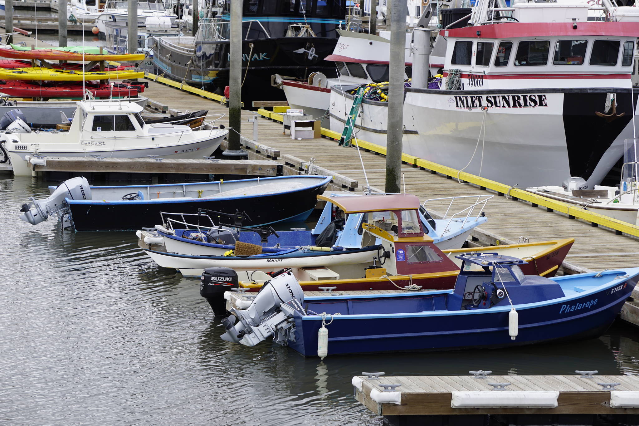 A row of skiffs and small boats are moored on Friday, May 21, 2021, at the Homer Harbor in Homer, Alaska. (Photo by Michael Armstrong/Homer News)