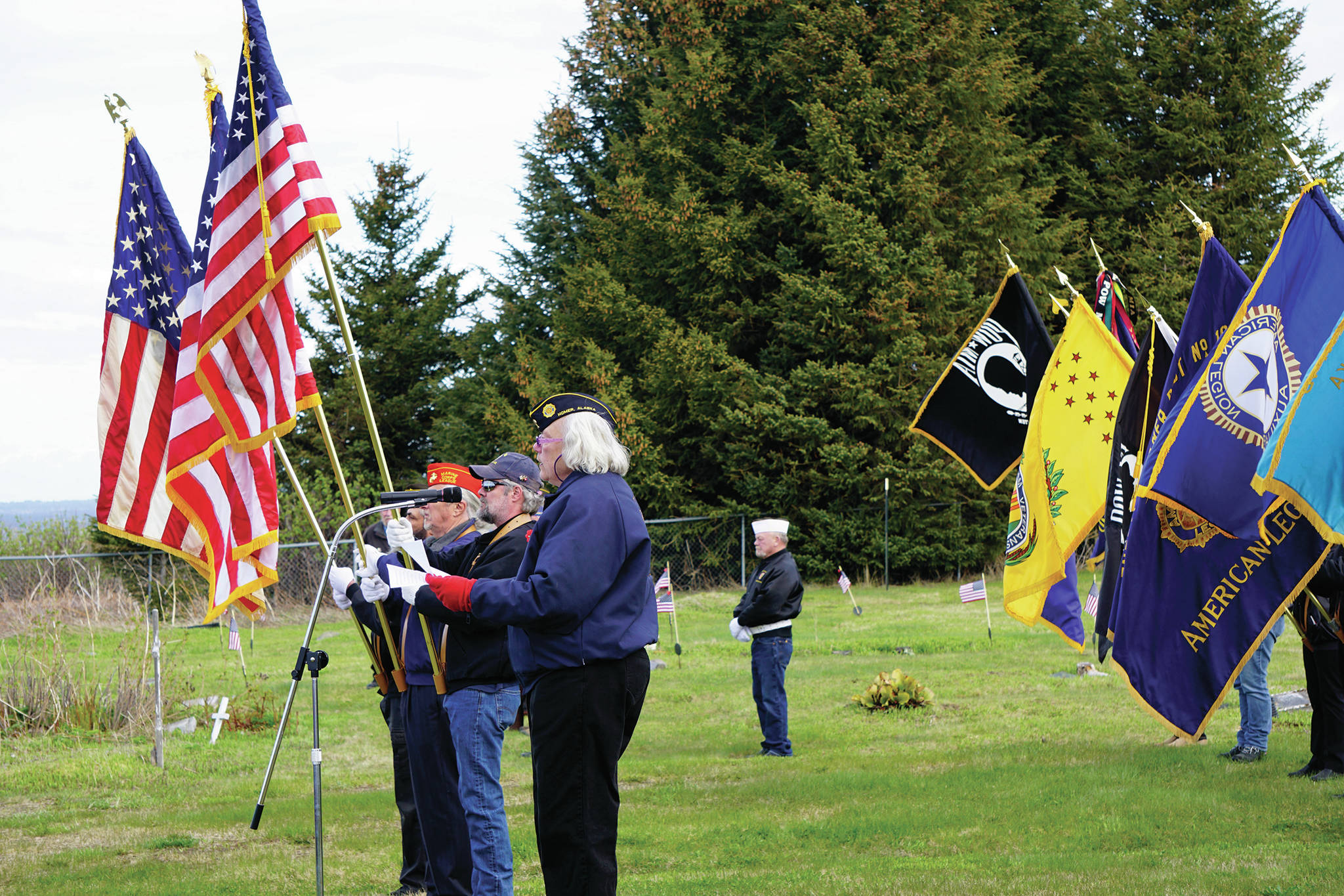 Eileen Faulkner delivers the Memorial Day address on Monday, May 25, 2020, at the Hickerson Memorial Cemetery on Diamond Ridge near Homer, Alaska. Standing next to her are color guards from the Homer and Ninilchik American Legions and the Anchor Point Veterans of Foreign War (Photo by Michael Armstrong/Homer News)