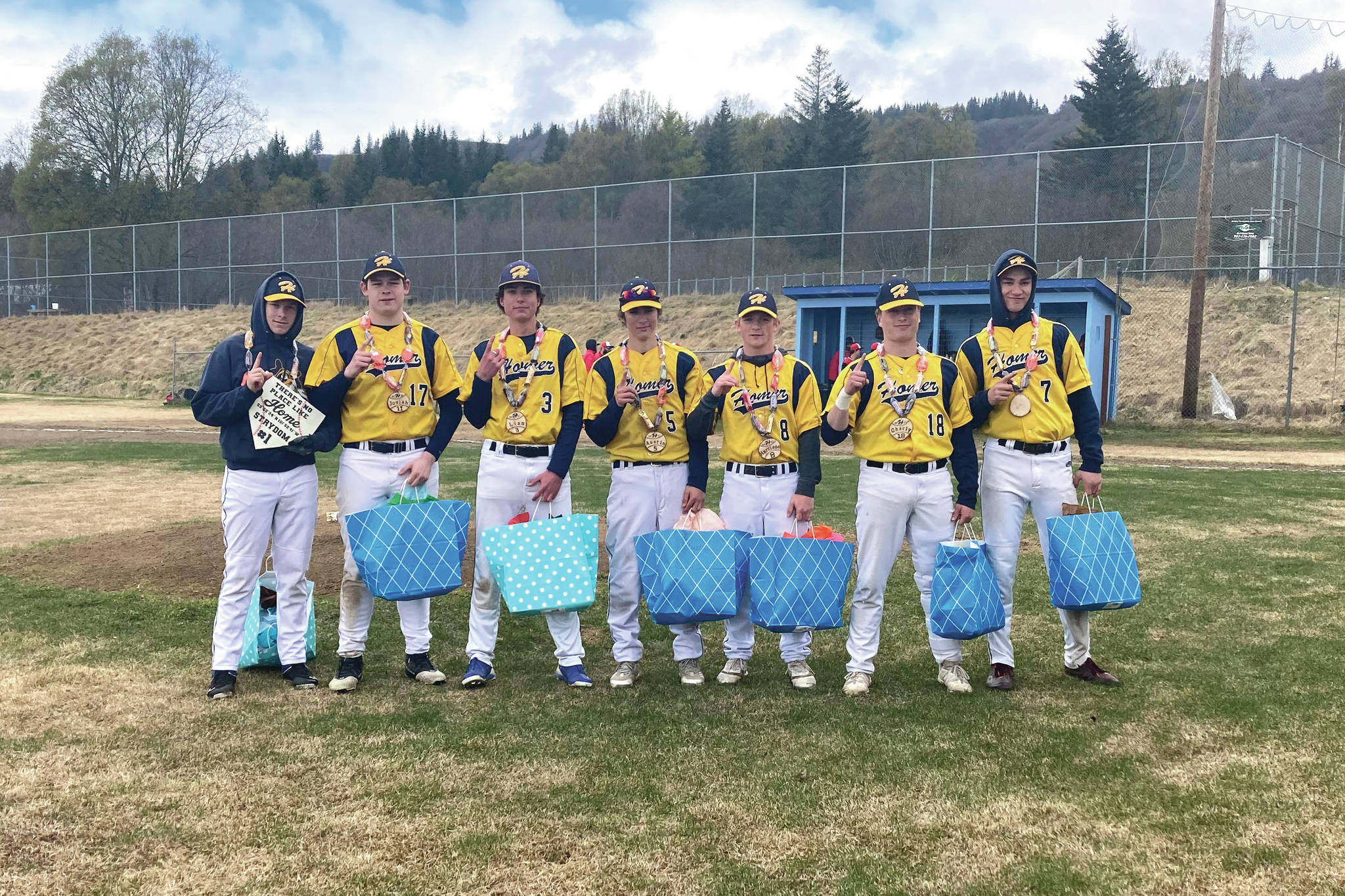 Seven seniors on the Homer High School baseball team were honored Saturday, May 22 during senior night. The team won against Kenai 11-3. Pictured left to right: Jack Strydom, Josiah Raymond, Liam Houlihan, Austin Ceccarelli, Harrison Metz, Charly Tappen and Coda Wood. (Photo by Sarah Knapp/Homer News)