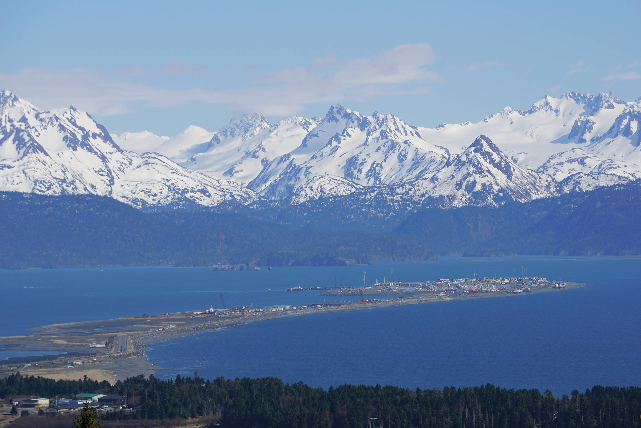 The Homer Spit and the Kenai Mountains catch the afternoon sunshine of Monday, May 17, 2021, as seen from West Hill in Homer, Alaska. (Photo by Michael Armstrong/Homer News)