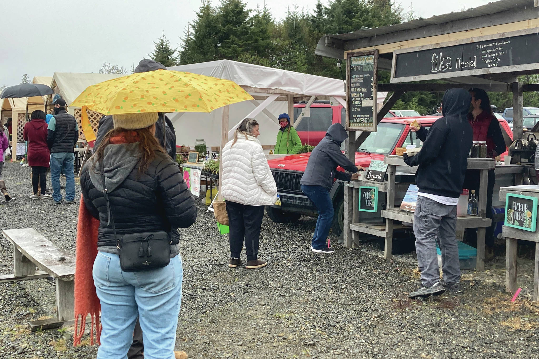 Homer community members stand in line at the farmers market to purchase coffee. The Farmers Market returned Saturday, May 29.
