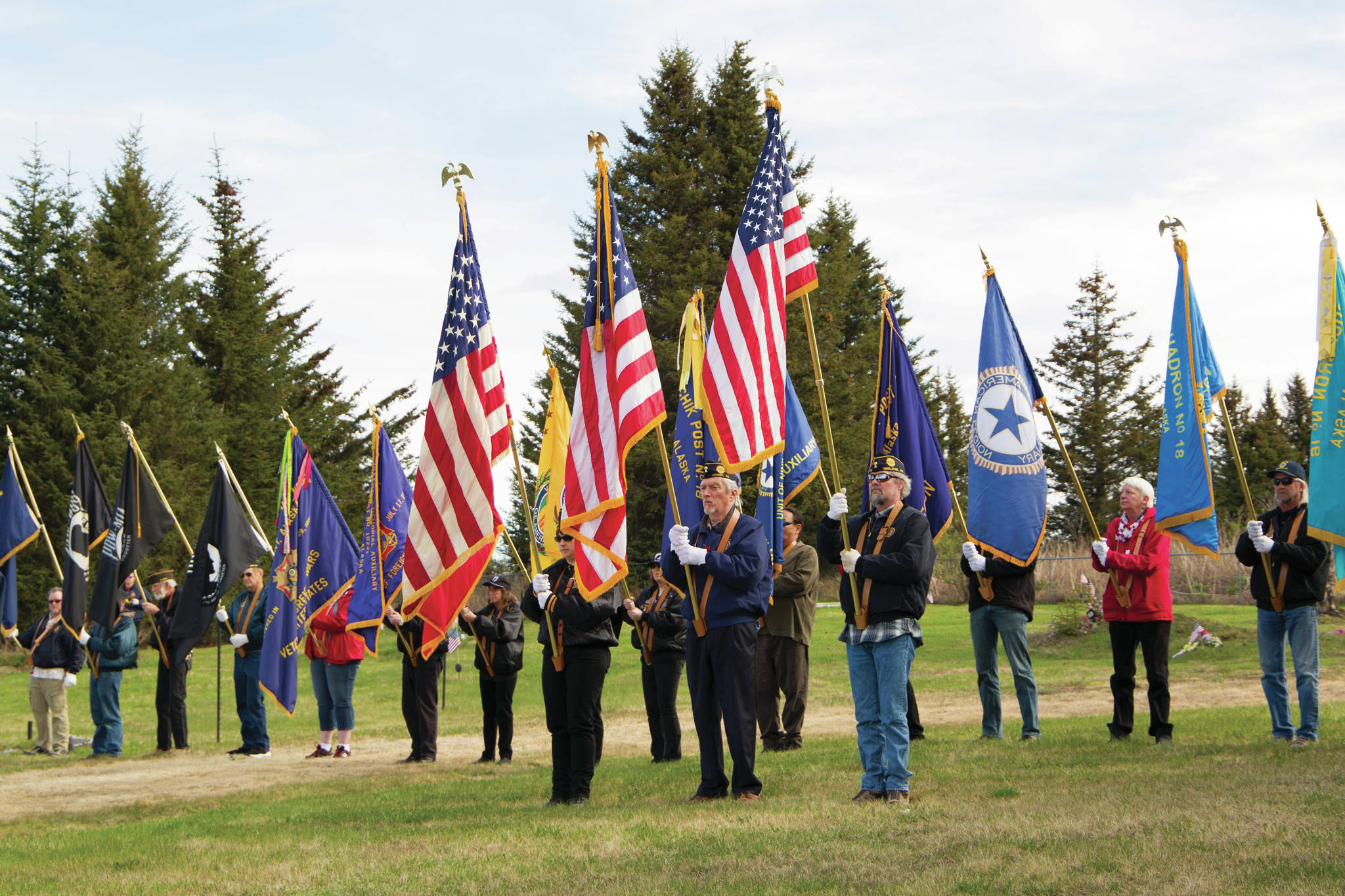 The American Legion Posts 16 and 19 and the Veterans of Foreign Wars Post 10221 color guards stand at attention during the 2021 Memorial Day service held at Hickerson Memorial Cemetery on May 31. (Photo by Sarah Knapp/Homer News)