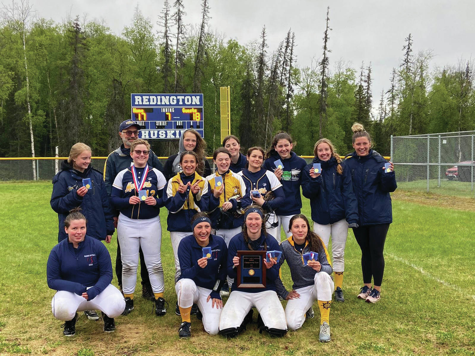 The Homer Mariner softball team celebrates after winning the Northern Lights Conference in an 18-17 win over Kodaik. (Photo courtesy Homer Mariner Softball team)