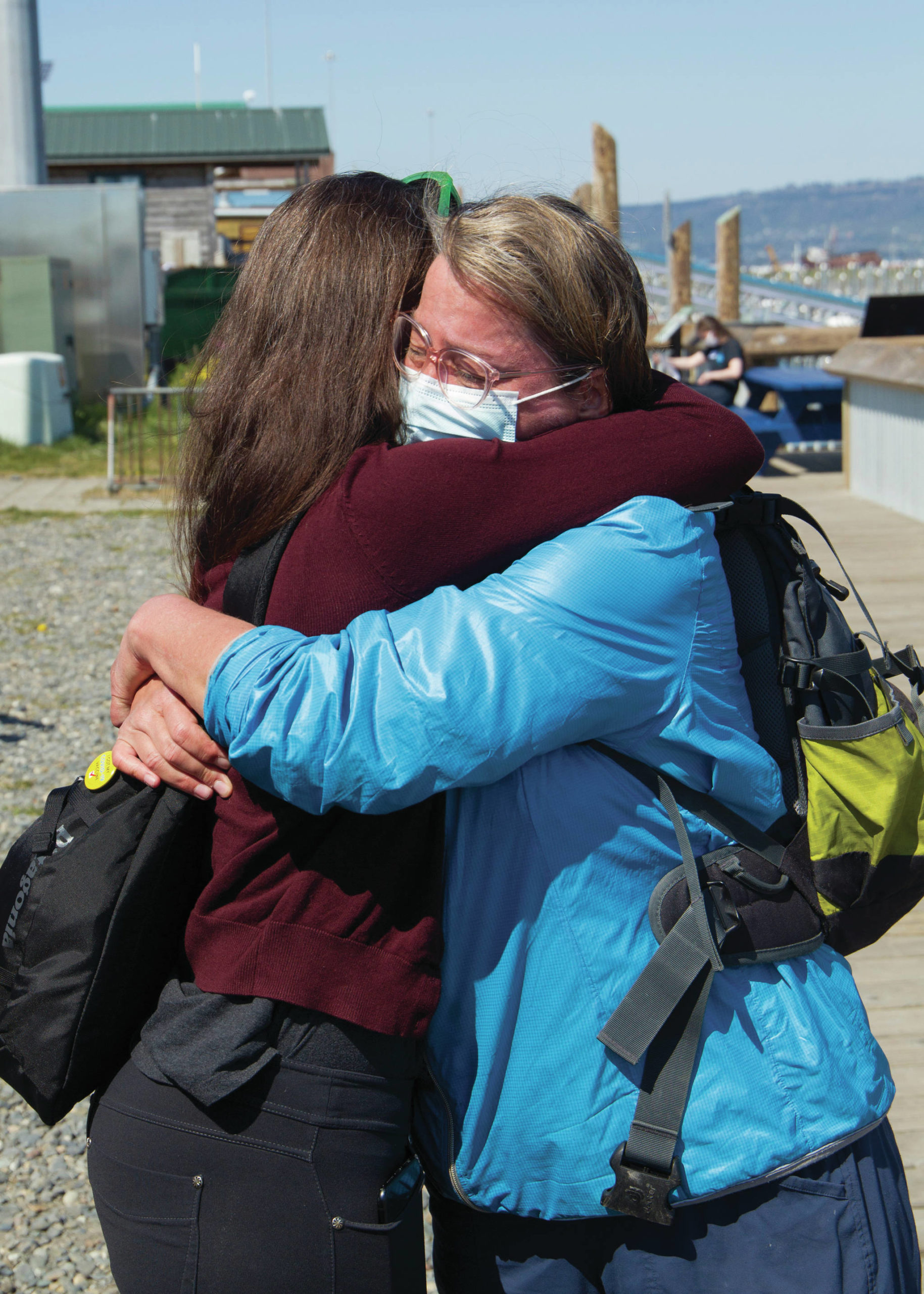 Alaska Chief Medical Officer Anne Zink, M.D., left, hugs Amy Russell, right, on Thursday, May 27, 2021, at a pop-up vaccination clinic on the Homer Spit in Homer, Alaska. (Photo by Sarah Knapp/Homer News)