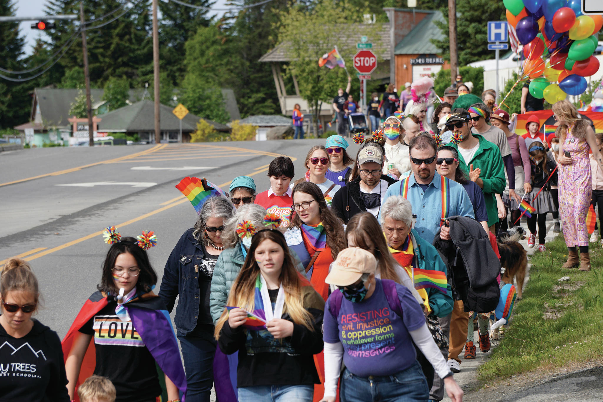People march in a combined Pride and Juneteenth event on Saturday, June 19, 2021, along Pioneer Avenue in Homer, Alaska. (Photo by Michael Armstrong/Homer News)