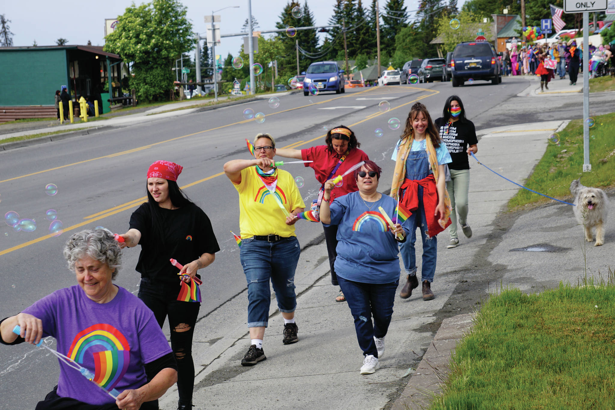 People march in a combined Pride and Juneteenth event on Saturday, June 19, 2021, along Pioneer Avenue in Homer, Alaska. (Photo by Michael Armstrong/Homer News)