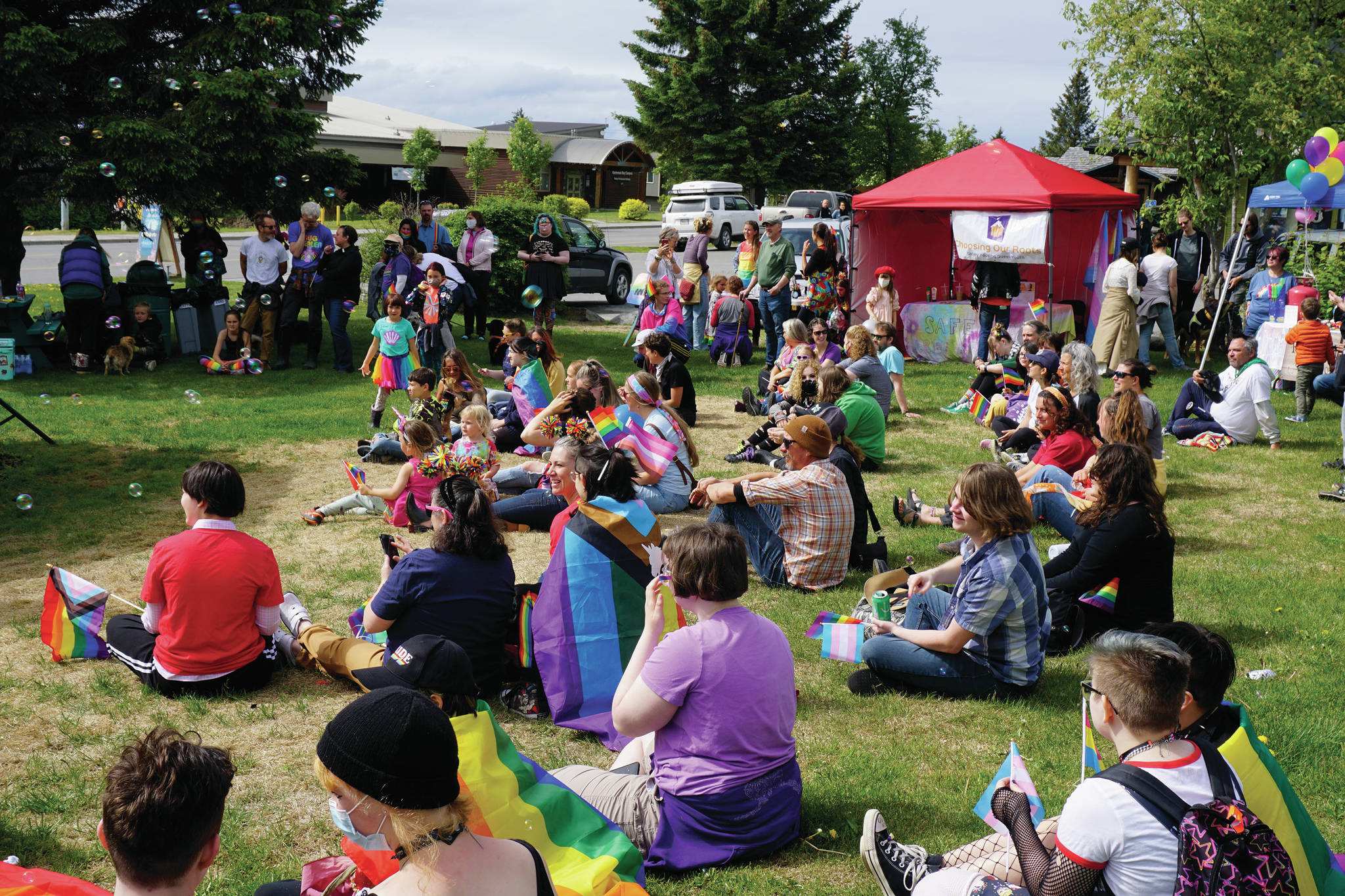 People listen to speakers at a combined Pride and Juneteenth event on Saturday, June 19, 2021, at Wisdom, Knowledge, Faith and Love Park in Homer, Alaska. (Photo by Michael Armstrong/Homer News)