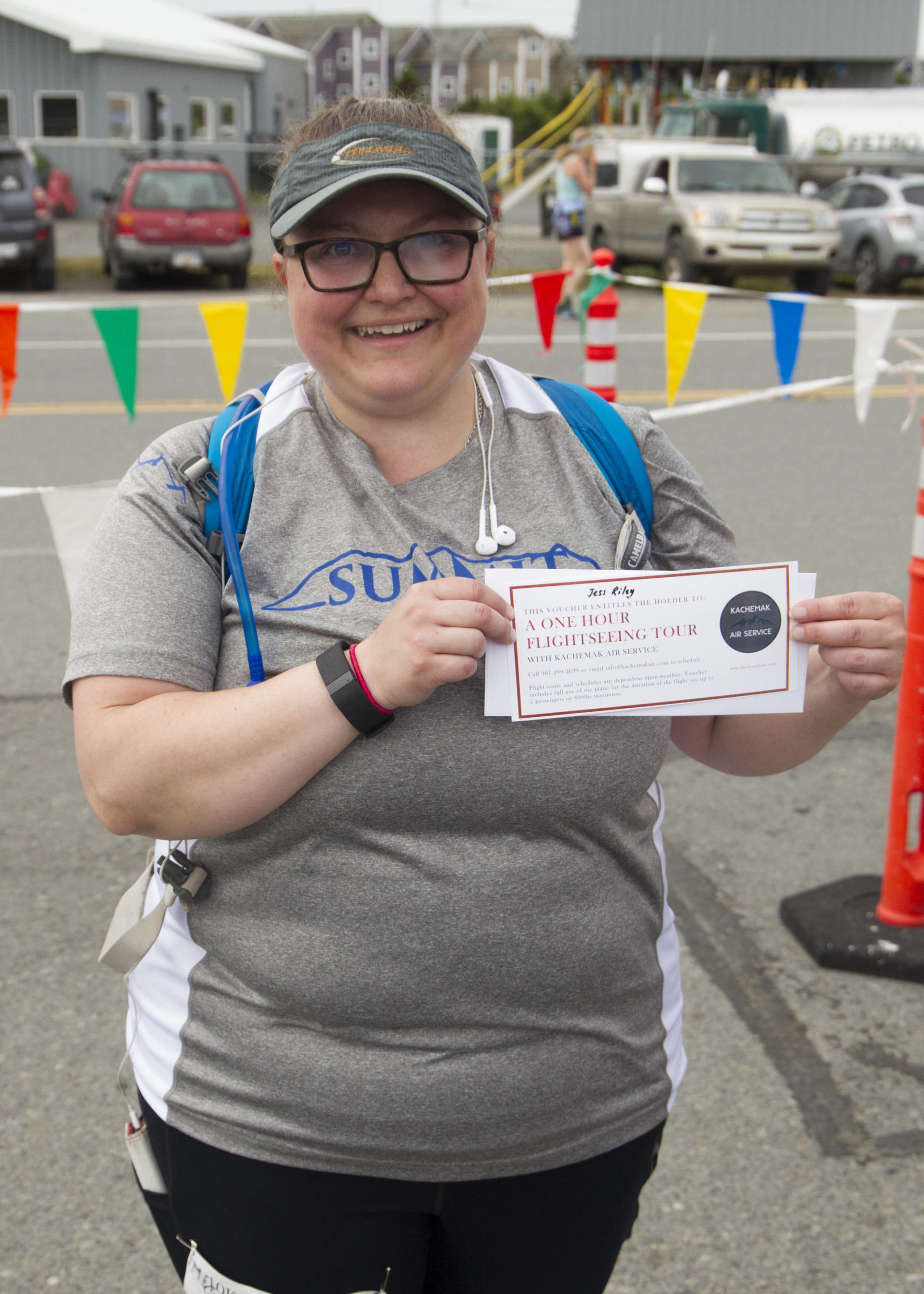 Jess Riley, who walked in the untimed 10K on June 26, was randomly selected to win a Homer Flightseeing trip from Kachemak Air Service. (Photo by Sarah Knapp/Homer News)