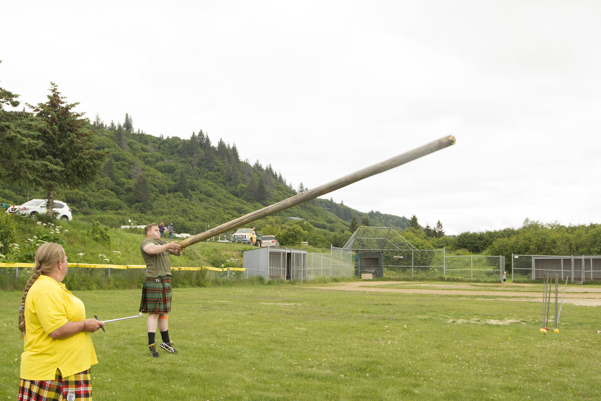 Athletes competed in the caber toss at the 2021 Kachemak Bay Highland Games on Saturday, July 3. (Photo by Sarah Knapp/Homer News)