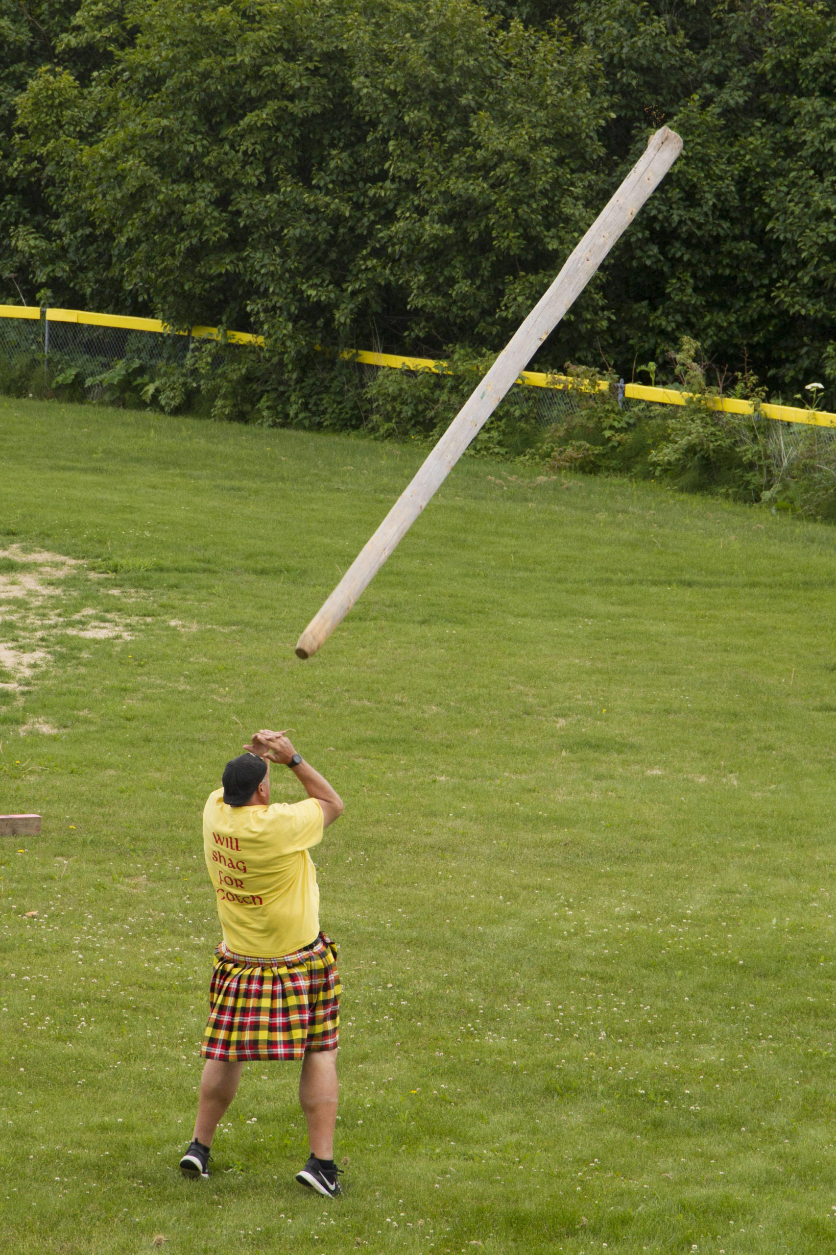 A competitor throws the caber during the caber toss at the 2021 Kachemak Bay Highland Games on Saturday, July 3. (Photo by Sarah Knapp/Homer News)
