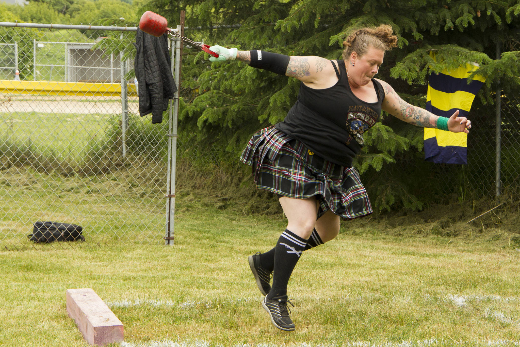 An athlete competes in the women’s heavy weight competition at the 2021 Kachemak Bay Highland Games on Saturday, July 3. (Photo by Sarah Knapp/Homer News)