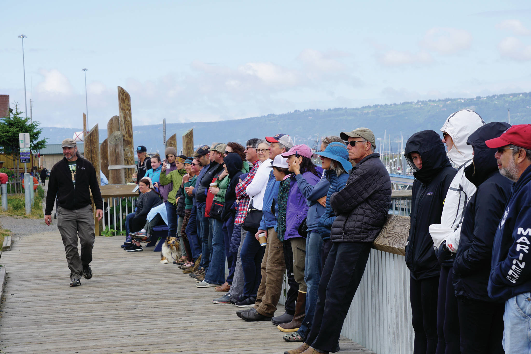A standing-room only crowd listens to the Yale University Whiffenpoofs perform in a concert Thursday, July 8, 2021, at the Boathouse Pavillion in Homer, Alaska. (Photo by Michael Armstrong/Homer News)