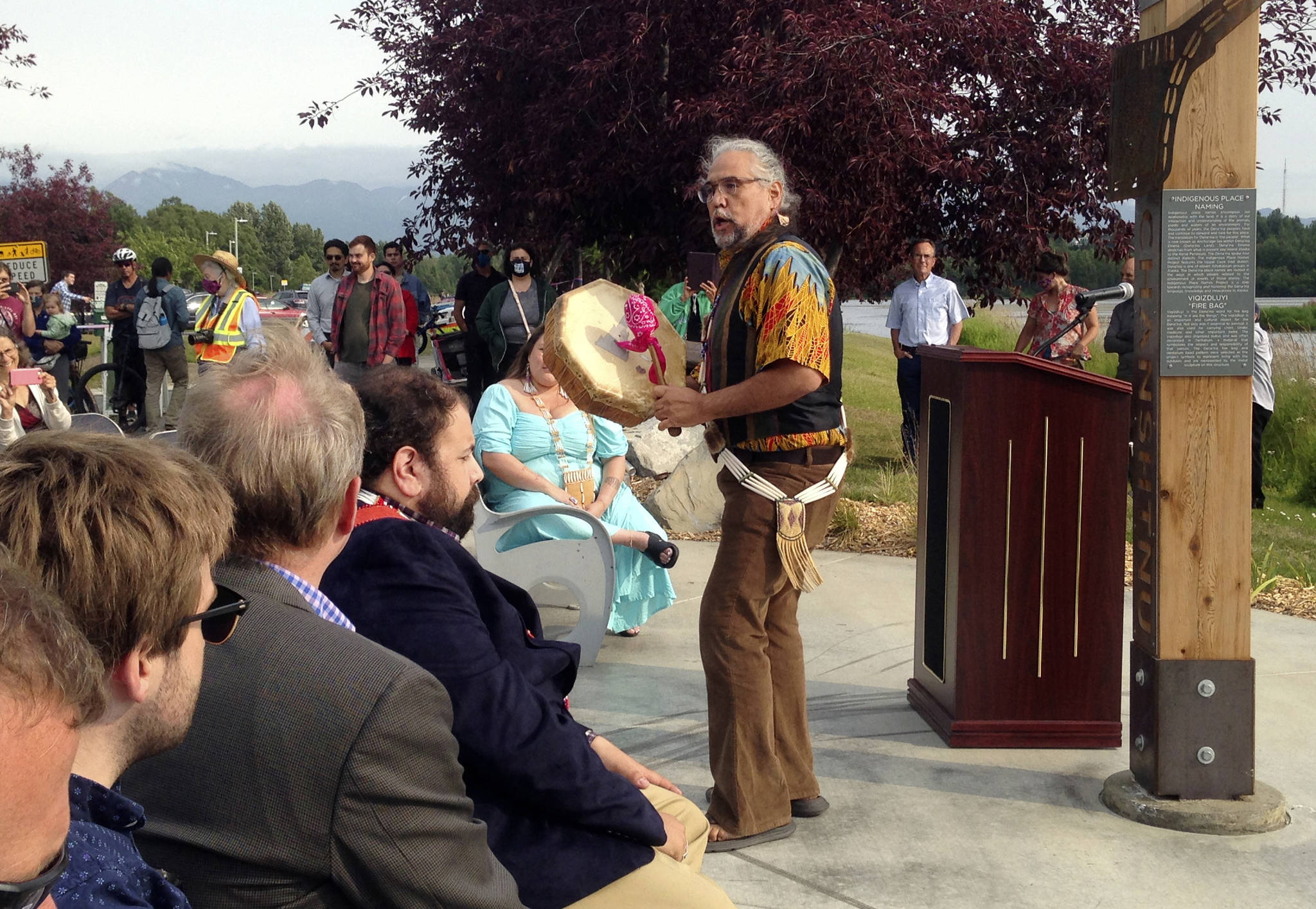 Athabascan singer and storyteller George Holly, performs at the unveiling of a place-name marker at Chanshtnu, or “grassy creek,” the Dena’ina Athabascan name for Westchester Lagoon, on Tuesday, Aug. 3, 2021, in Anchorage, Alaska. (Joaqlin Estus / Indian Country Today)