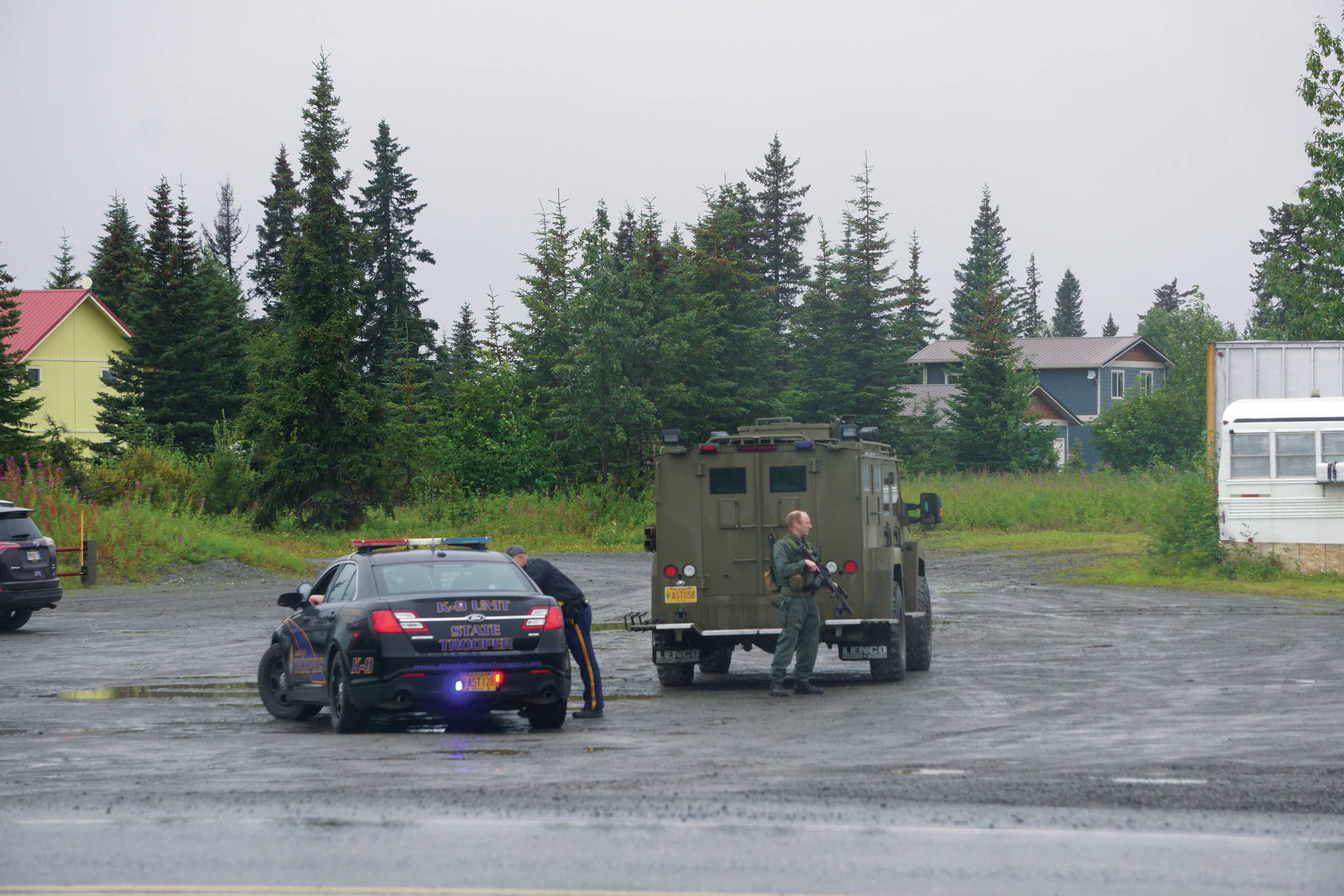 Alaska State Troopers and members of the Special Emergency Reaction Team respond at a shooting scene on Monday, Aug. 23, 2021, at the Anchor Point Warehouse in Anchor Point, Alaska, on the Sterling Highway. An Alaska State Trooper was shot and is in fair condition at an Anchorage hospital. Troopers arrested the suspect, Bret Herrick, 60, on Tuesday morning, Aug. 24, 2021. (Photo by Michael Armstrong/Homer News)