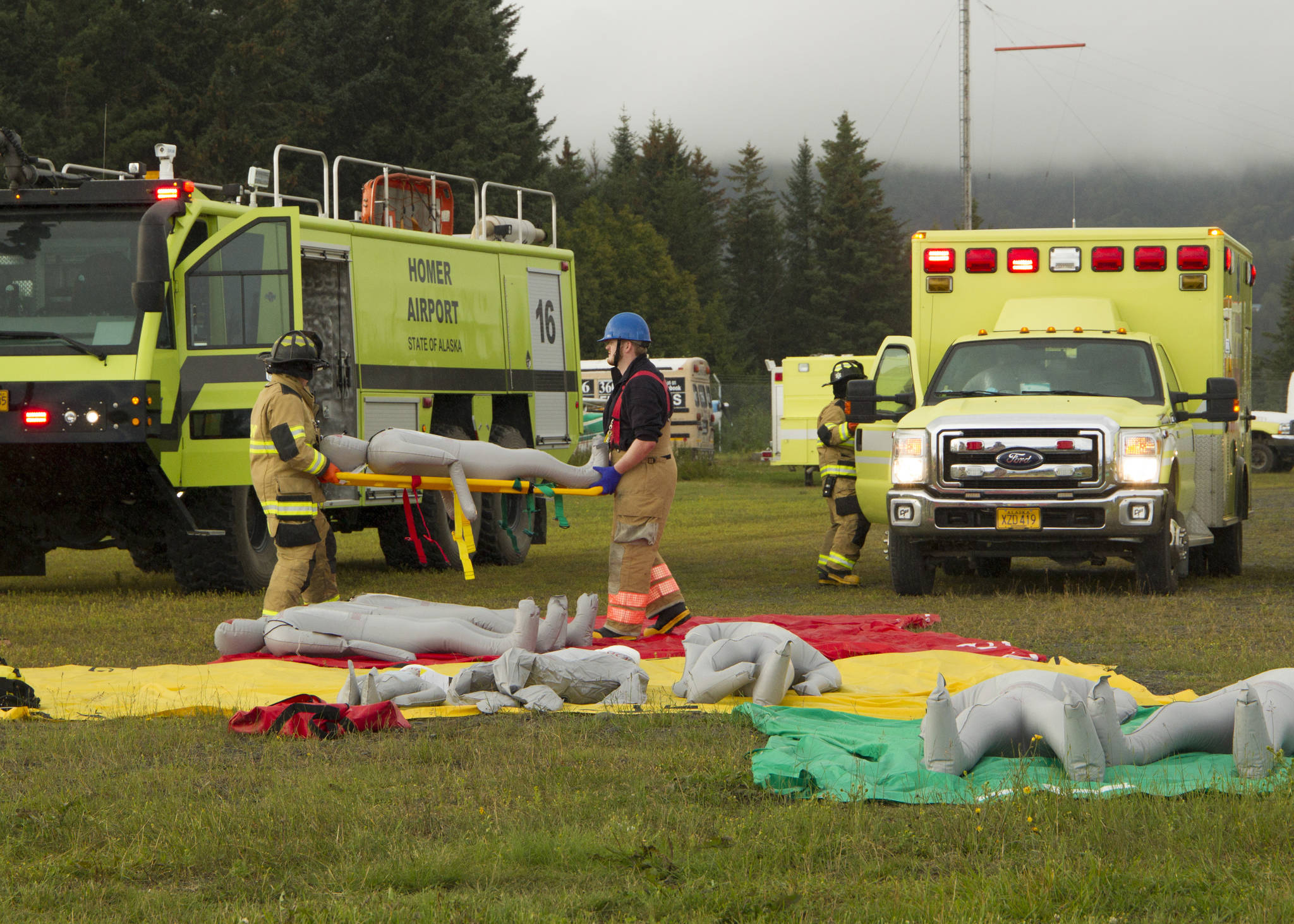 Emergency responders participate in a mass casualty emergency drill at Homer Airport on Tuesday, Aug. 24. The responders were responsible for recovering victims from a mock plane crash, triaging and transporting them to medical facilities. (Photo by Sarah Knapp/Homer News)