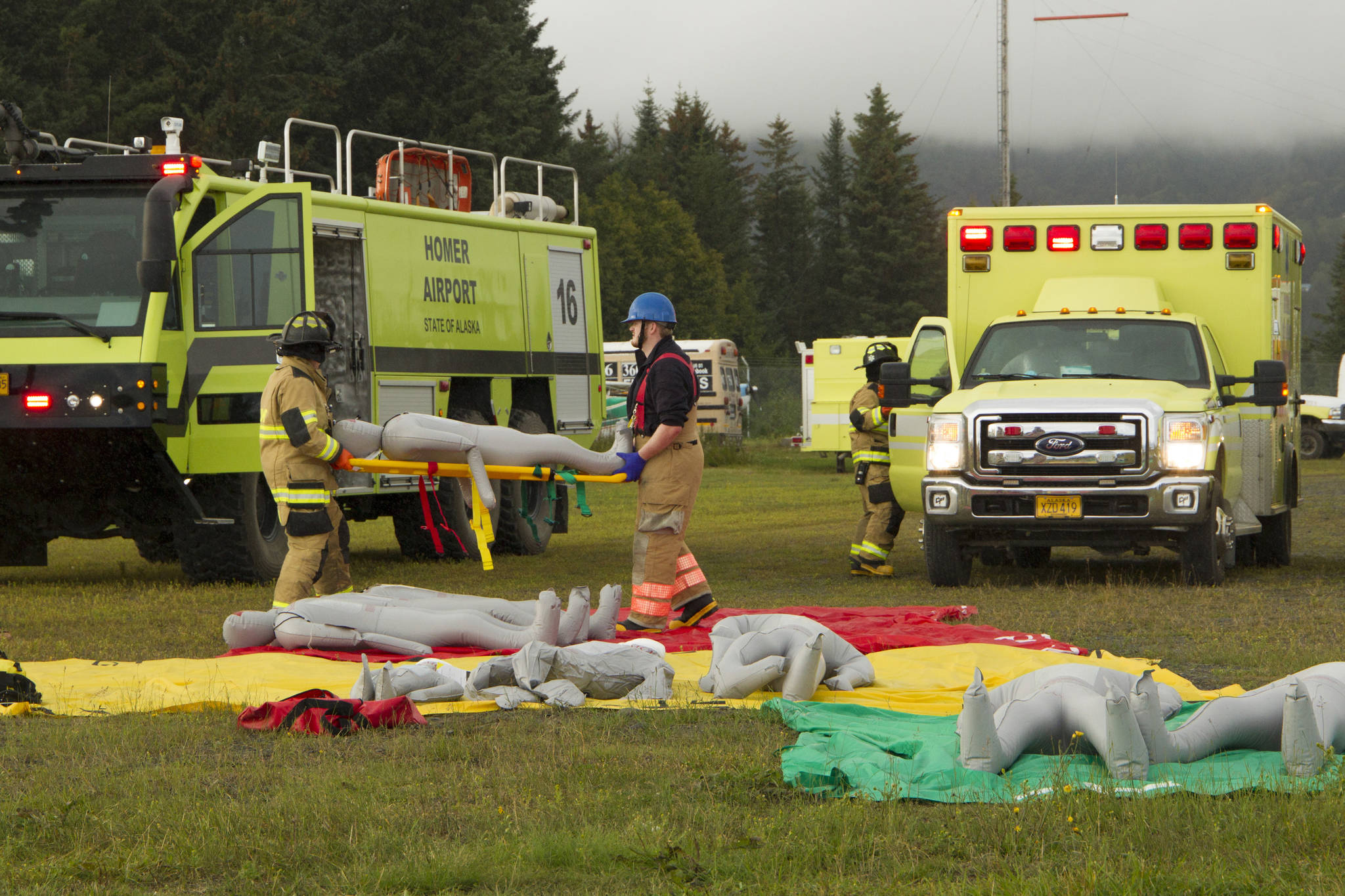 Emergency responders participate in a mass casualty emergency drill at Homer Airport on Tuesday, Aug. 24. The responders were responsible for recovering victims from a mock plane crash, triaging and transporting them to medical facilities. (Photo by Sarah Knapp/Homer News)