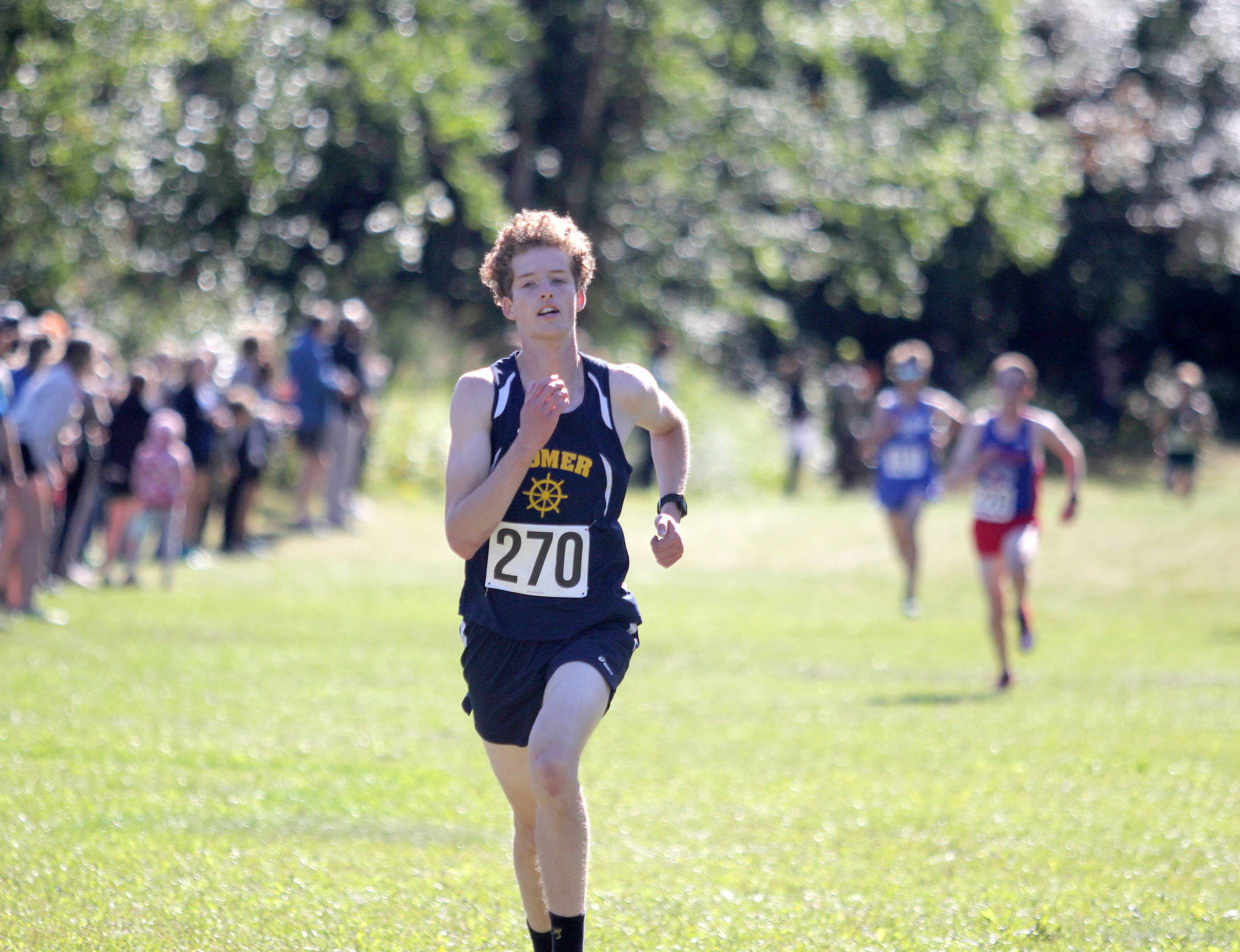 Seamus McDonough sprints toward the finish during the Colony Invitational on Saturday, Aug. 28, 2021, at Colony High School. McDonough placed eighth. (Photo by Jeremiah Bartz/Frontiersman)