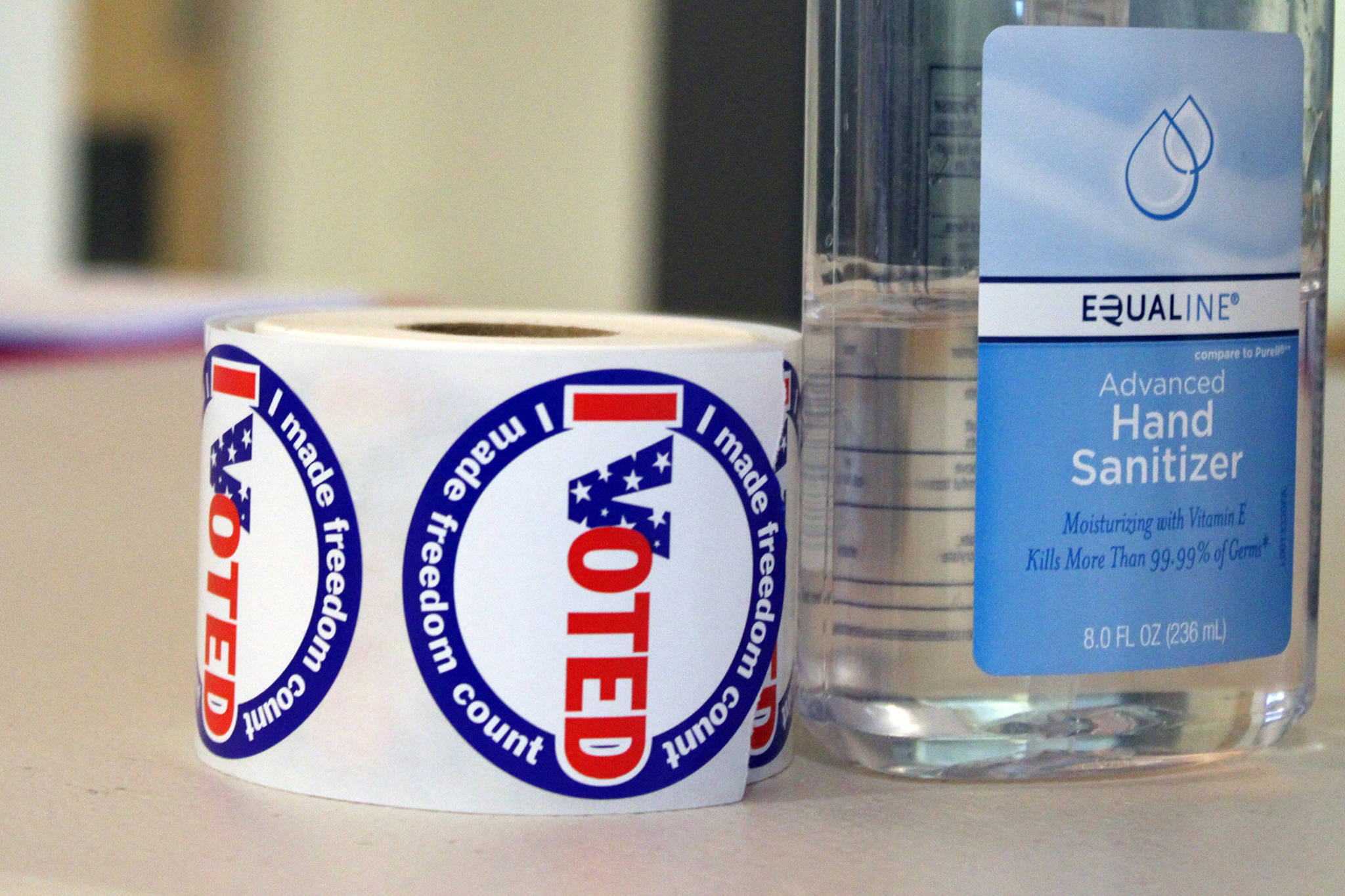 A roll of "I Voted" stickers sits next to a bottle of hand sanitizer in this October 2020 photo. (Ben Hohenstatt / Juneau Empire)