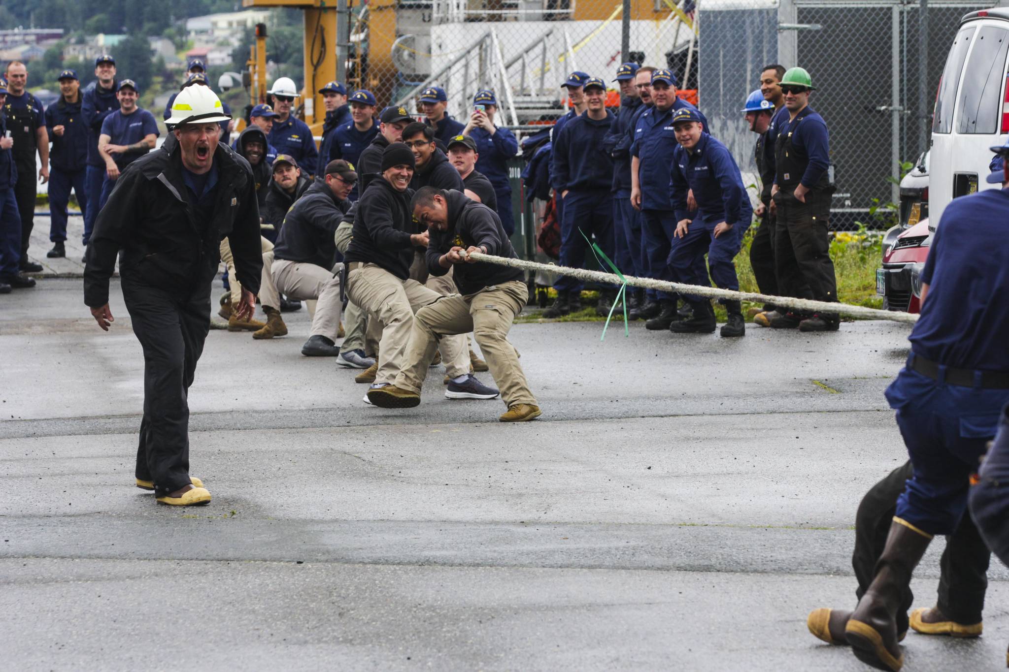 Army divers, in the khaki pants, compete against a team of Coast Guardsmen in the tug of war, one of the inter-vessel competitions during this year’s Buoy Tender Roundup at Sector Juneau, on Wednesday, Aug. 25, 2021. (Michael S. Lockett / Juneau Empire)