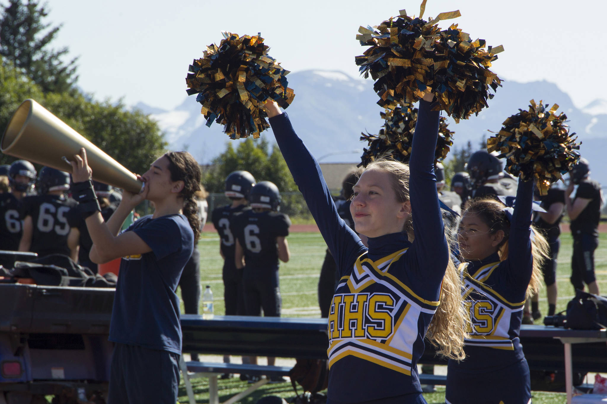 The Homer Mariner cheerleaders pep up the crowd during the Homer vs. Kodiak game Saturday, Aug. 28. The squad’s cheers could be heard by all as Homer won 34-0. (Photo by Sarah Knapp/Homer News)