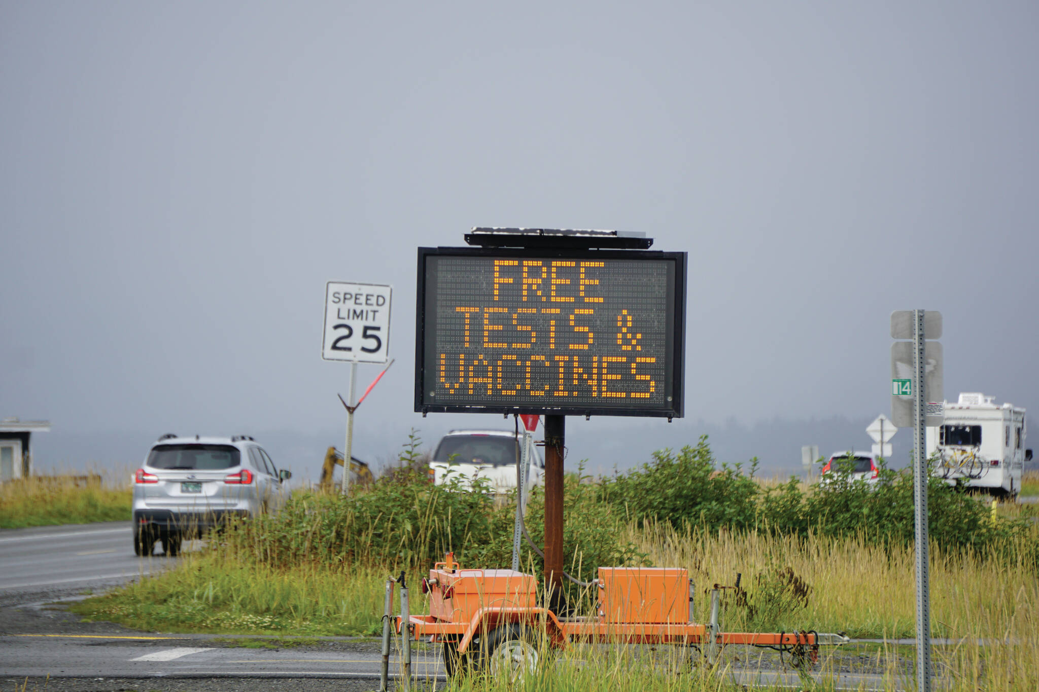 A sign flashing "Keep COVID down" also offers information on where to get testing and vaccines on Thursday, Sept. 2, 2021, on the Homer Spit in Homer, Alaska. (Photo by Michael Armstrong/Homer News)
