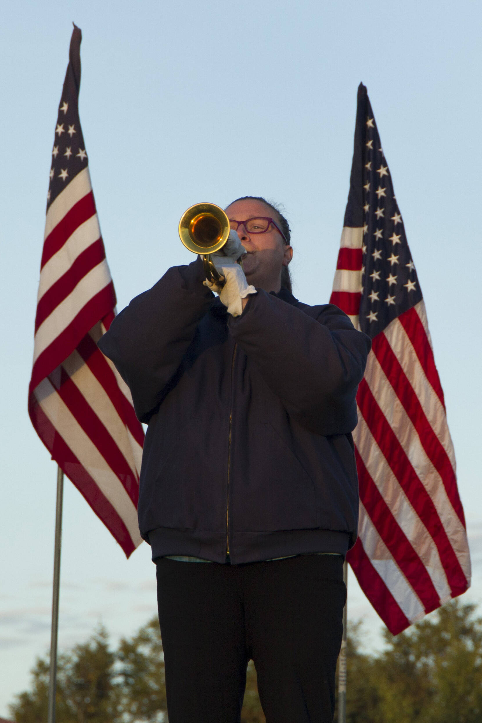 Christie Hill plays “Taps” during the 9/11 memorial service on Saturday. (Photo by Sarah Knapp/Homer News)