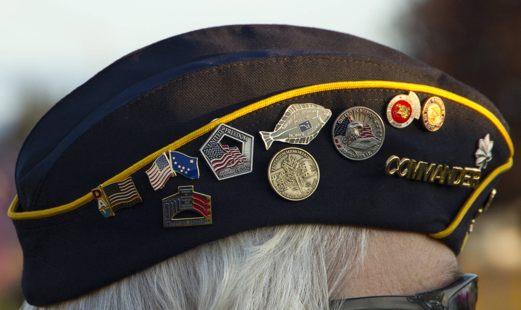Eileen Faulkner’s military cover features Sept. 11 memorial pins. (Photo by Sarah Knapp/Homer News)