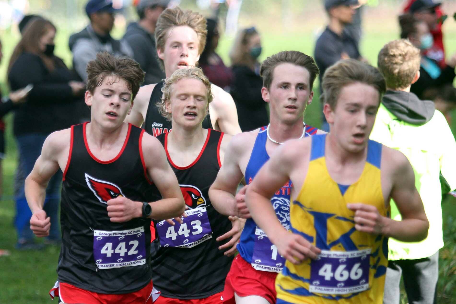 Kenai’s Gregory Fallon and Jack Laker try to gain position during the varsity boys race of the George Plumley Invitational on Saturday, Sept. 11, 2021, at Palmer High School. (Photo by Jeremiah Bartz/Frontiersman)