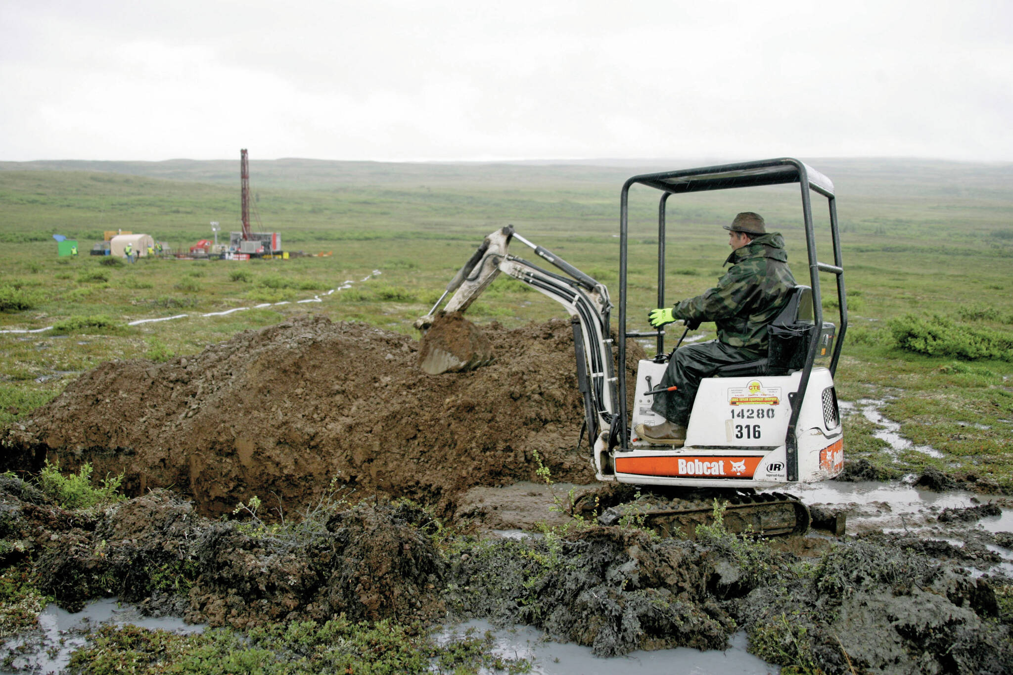 AP Photo / Al Grillo 
A worker with the Pebble Mine project digs in the Bristol Bay region of Alaska near the village of Iliamma, Alaska. The U.S. Environmental Protection Agency announced Thursday, Sept. 9, it would seek to restart a process that could restrict mining in Alaska’s Bristol Bay region, which is renowned for its salmon runs. The announcement is the latest in a long-running dispute over a proposed copper-and-gold mine in the southwest Alaska region.