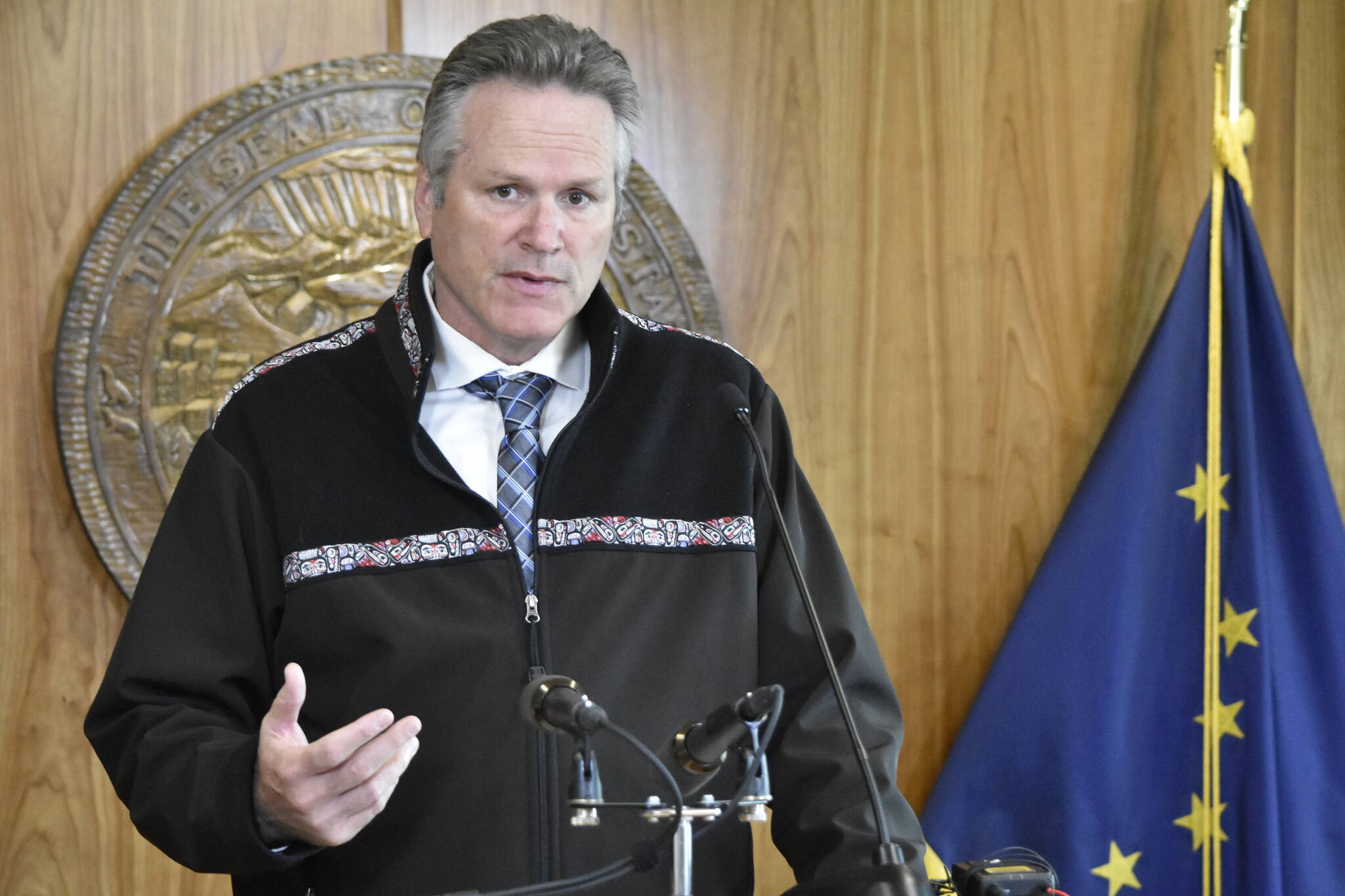 Gov. Mike Dunleavy, seen here at a Aug. 16, news conference, announced Thursday he was filing suit against the Biden administration for an Environmental Protection Agency decision to potentially protect Bristol Bay waters under the Clean Water Act. (Peter Segall / Juneau Empire file)