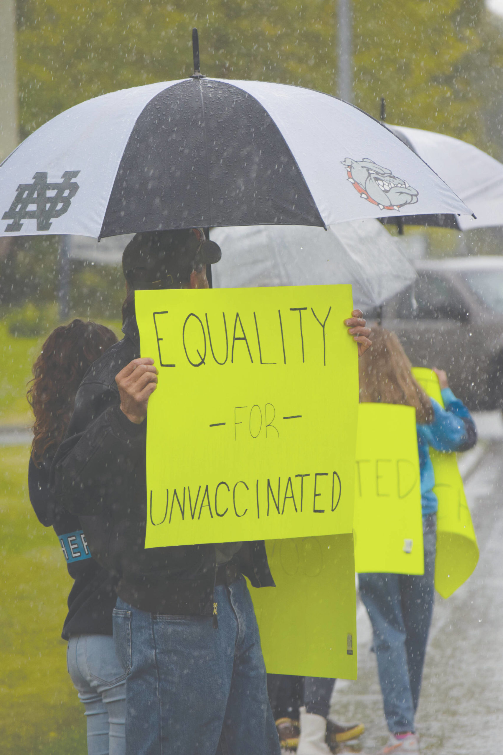 \Camille Botello/Peninsula Clarion
Protesters stand outside the George A. Navarre Borough Admin building in Soldotna on Tuesday.