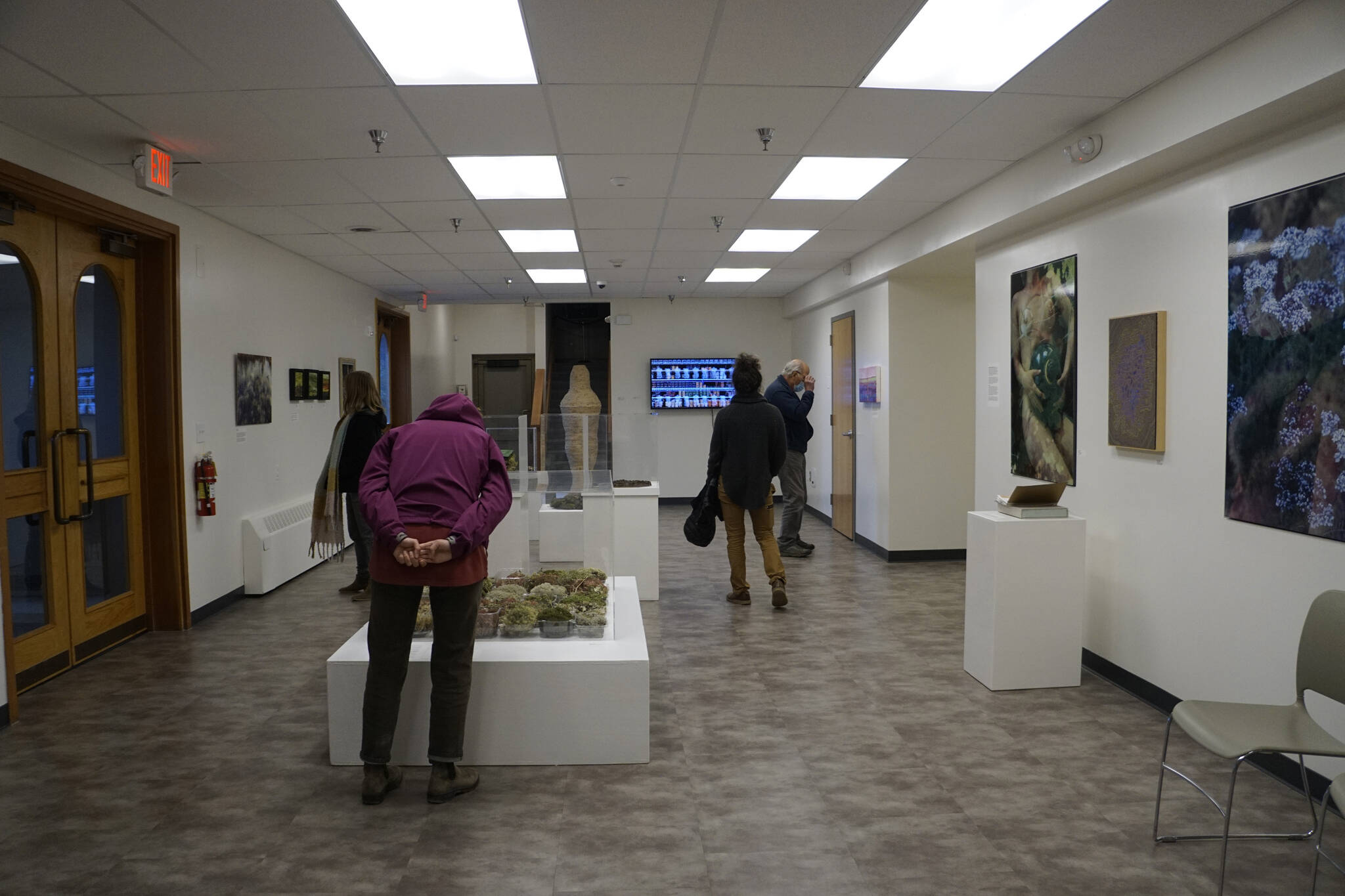 People visit the Homer Drawdown Peatland exhibit last Friday, Sept. 17, 2021, at a reception and talk at the Pratt Museum & Park in Homer, Alaska. (Photo by Michael Armstrong/Homer News)