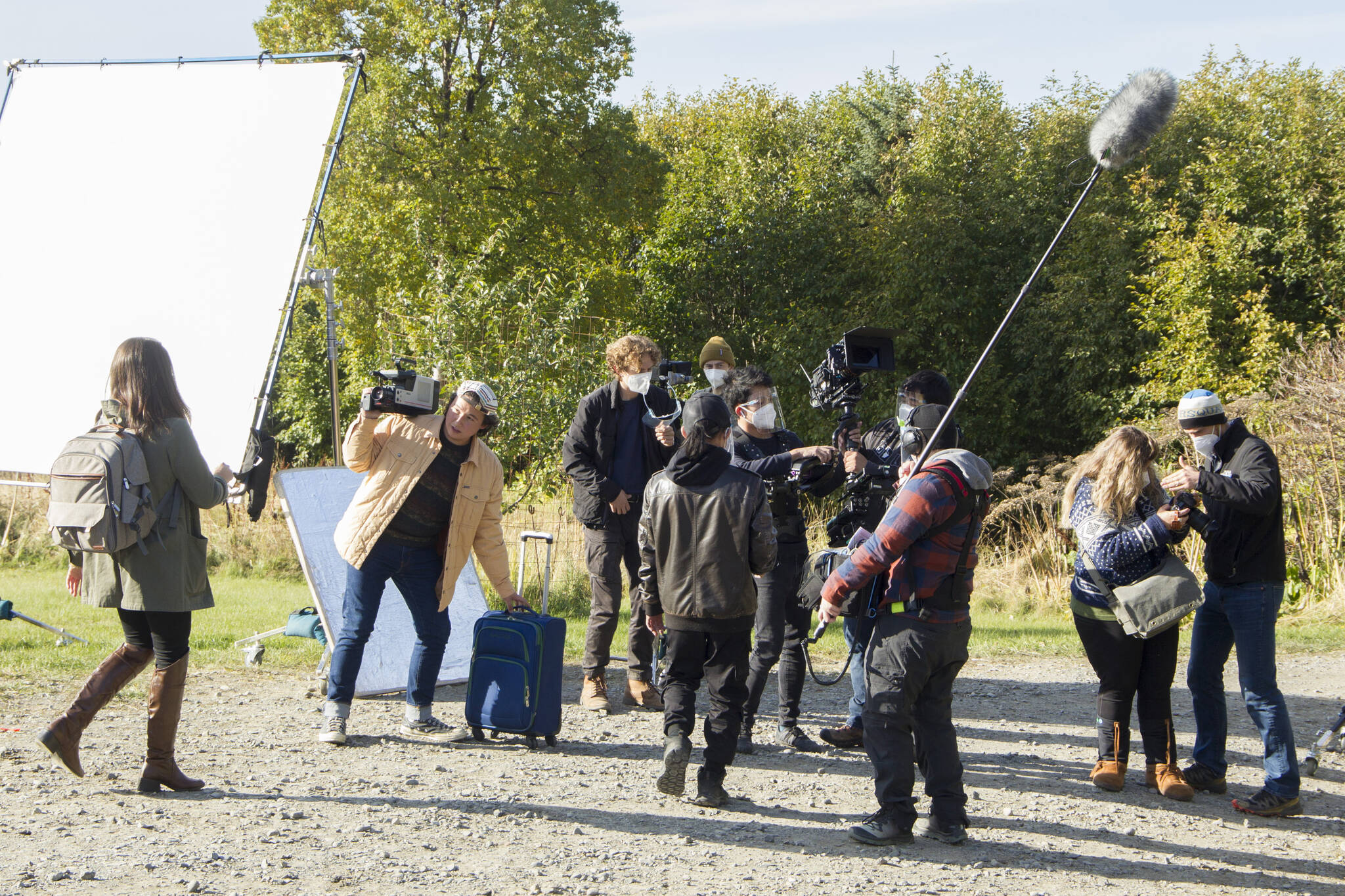 The Cosmic Hamlet Entertainment film crew and actors reset for a scene on the set of “Bolt from the Blue” at the Kilcher Homestead on Sept. 28. (Photo by Sarah Knapp/Homer News)