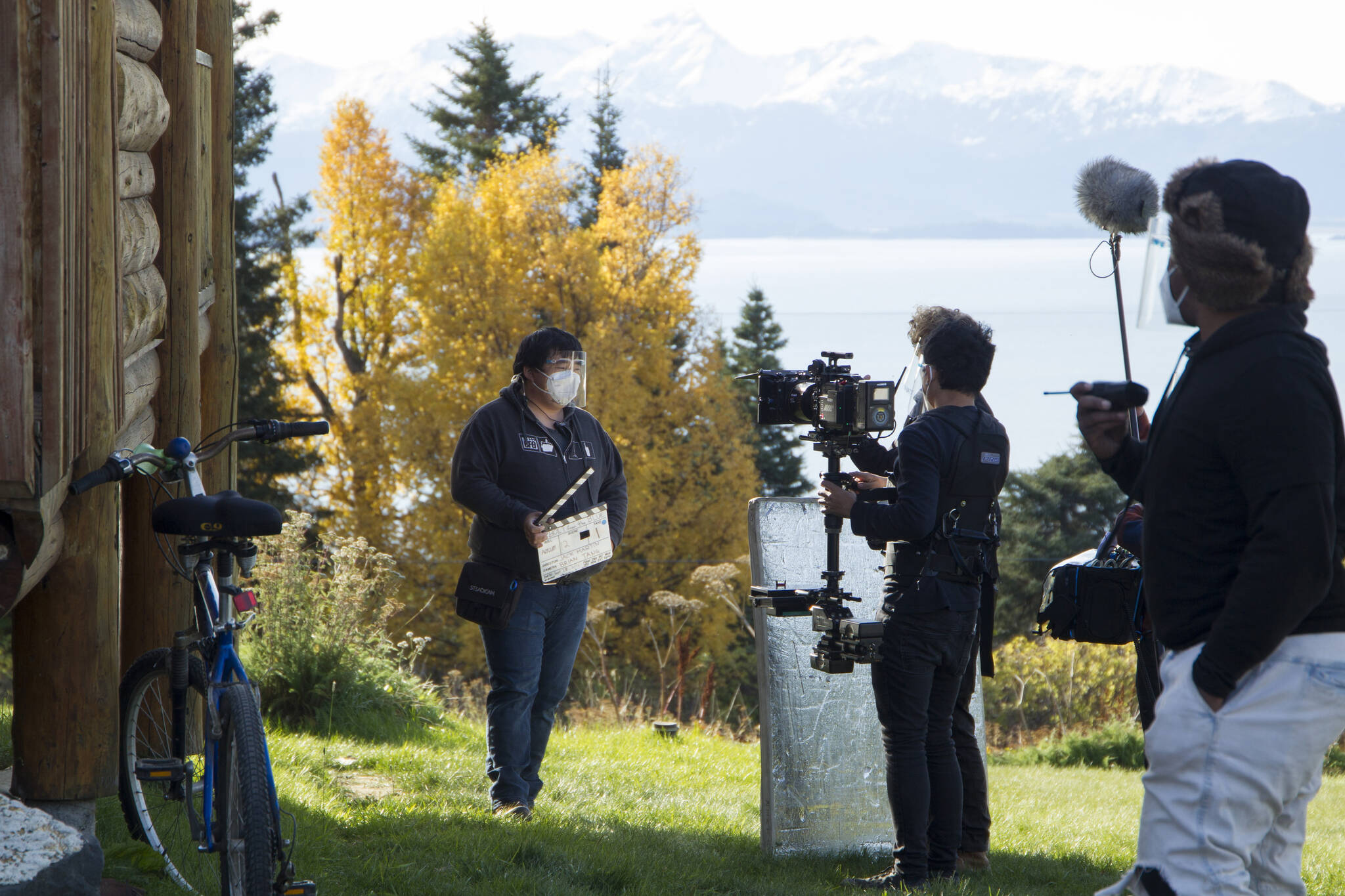 The Cosmic Hamlet Entertainment film crew prepares for a new scene to roll on the set of "Bolt from the Blue" at the Kilcher Homestead on Sept. 28. (Photo by Sarah Knapp/Homer News)