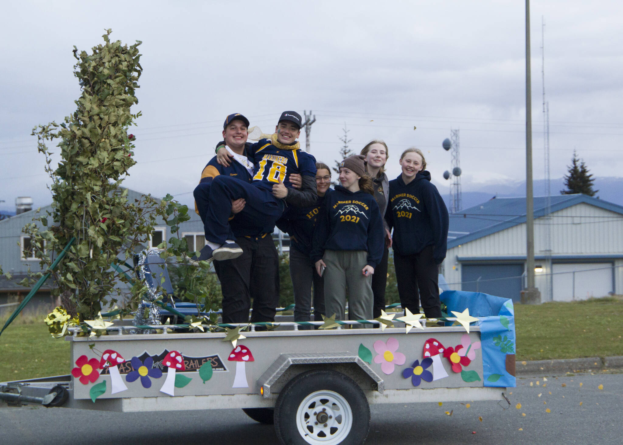 The Homer High School juniors pose on their float during the homecoming parade Friday, Oct. 1. (Photo by Sarah Knapp/ Homer News)