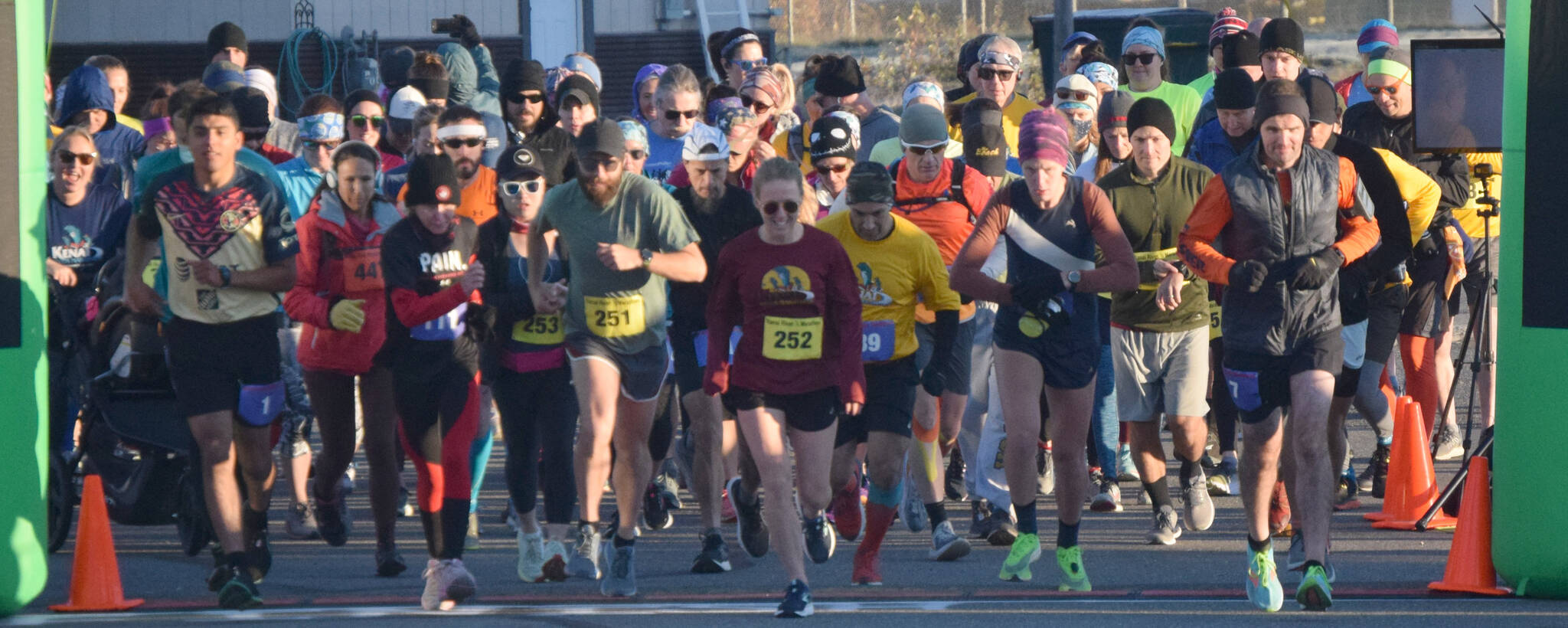 Author Kathleen Sorensen (252) and the rest of the field take off from the starting line at the Kenai River Marathon on Sunday, Sept. 26, 2021, in Kenai, Alaska. (Photo by Jeff Helminiak/Peninsula Clarion)