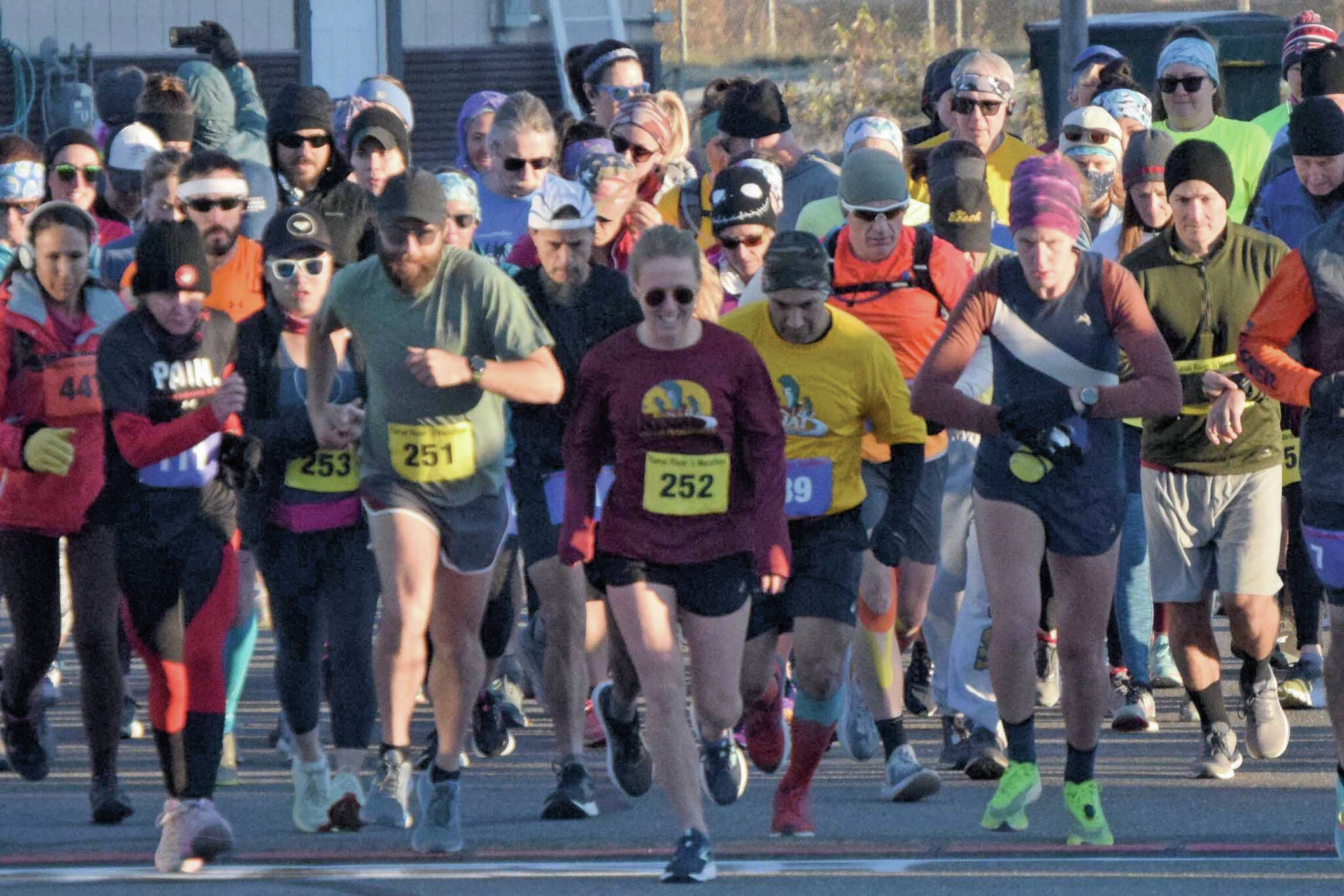 Photo by Jeff Helminiak/Peninsula Clarion
Author Kat Sorensen (252) and the rest of the field take off from the starting line at the Kenai River Marathon on Sunday, Sept. 26 in Kenai.