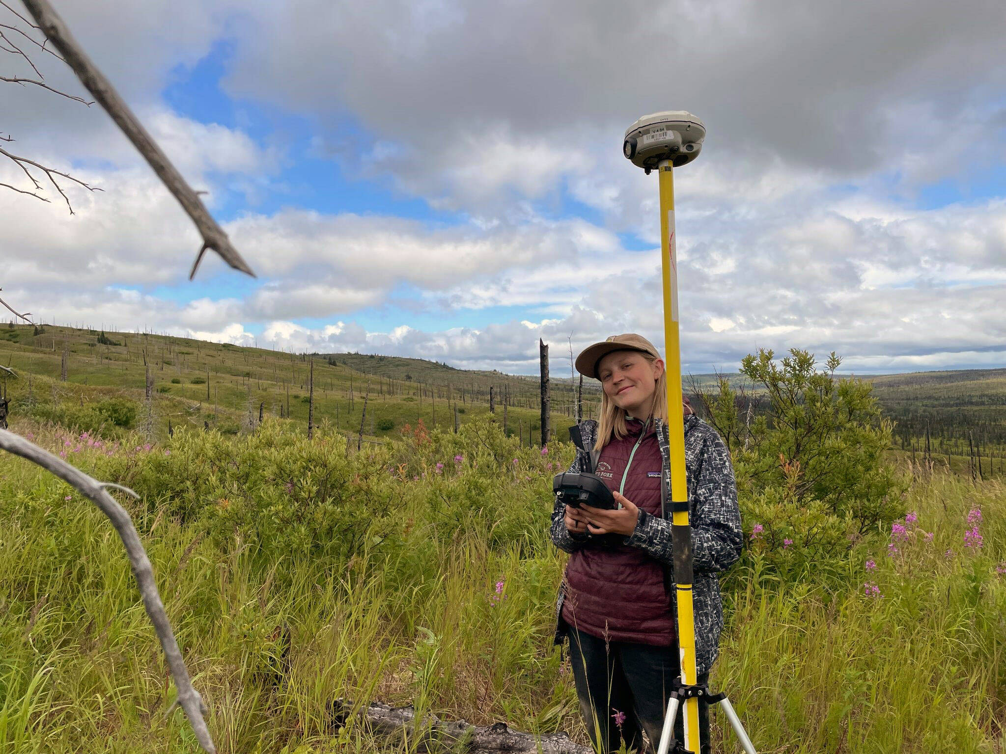 Photo by Angelica Smith/FWS 
Frannie Nelson collecting ground validation data for her undergraduate thesis in the Caribou Hills.