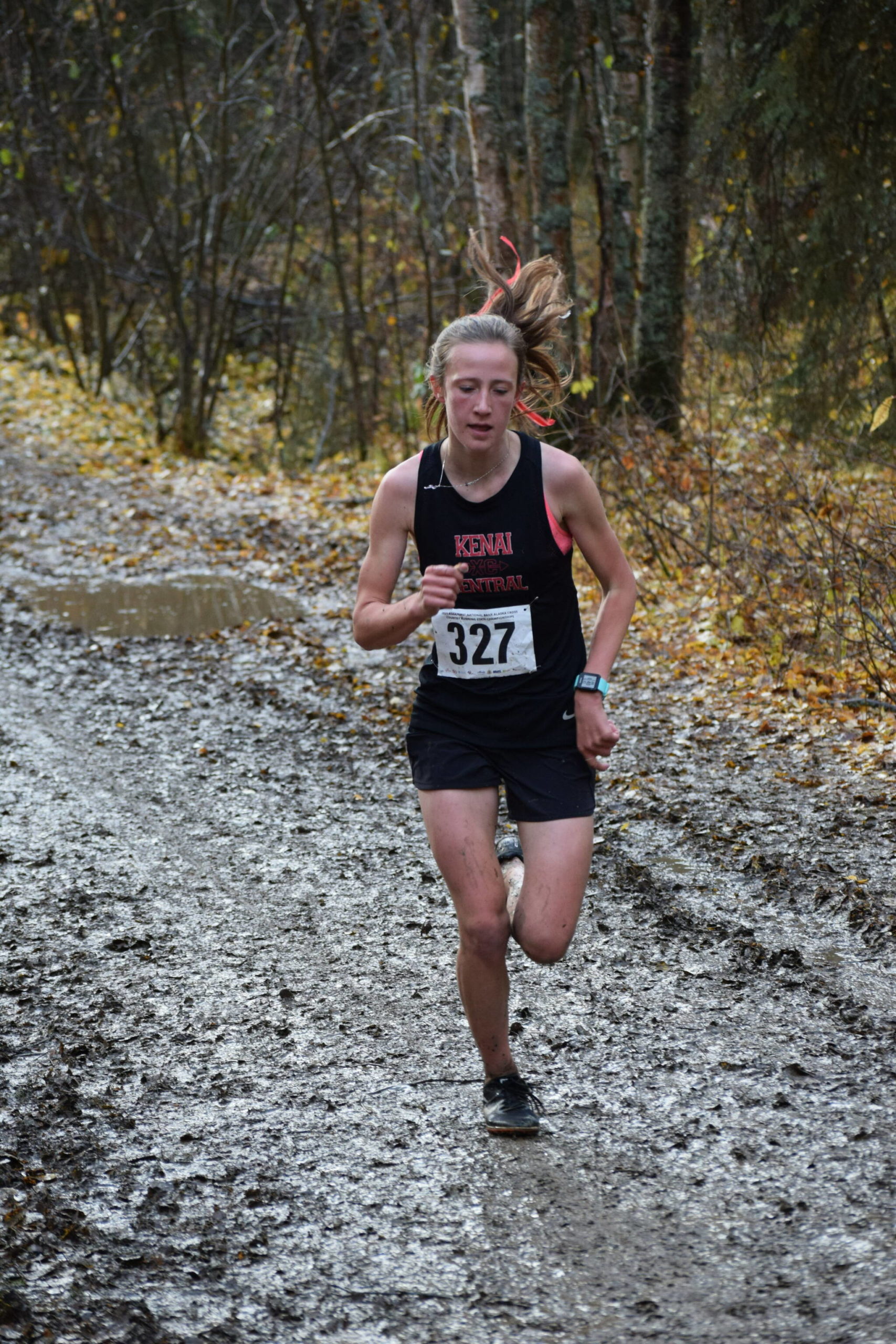 Jayna Boonstra of Kenai races her way to another Division II state cross country championship at Bartlett High School in Anchorage, Alaska on Saturday, Oct. 9, 2021. (Camille Botello/Peninsula Clarion)
