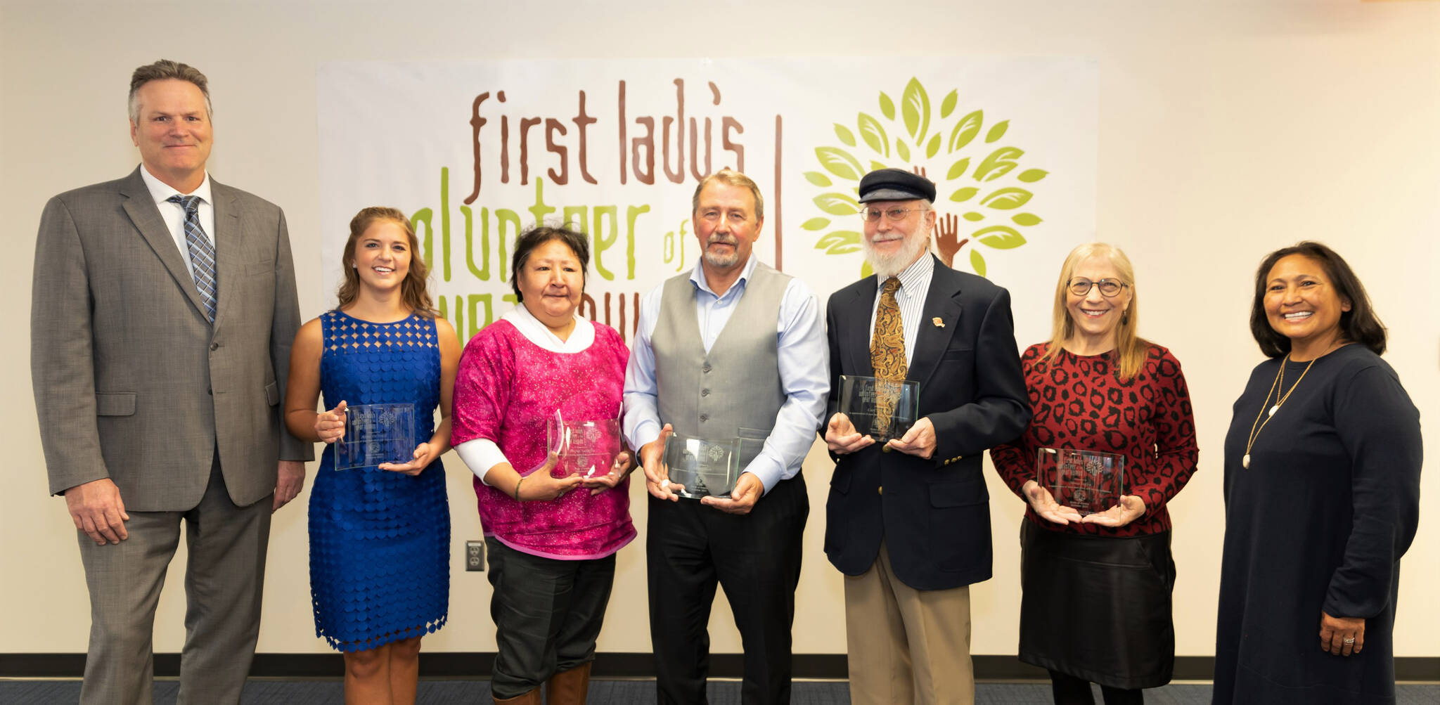 First Lady Rose Dunleavy, far right, and Gov. Mike Dunleavy, far right, pose with the 2021 Volunteer of the Year honorees. From left to right are Gov. Dunleavy, Anna DeVolld, Rachel Sallaffie, John Green, Carl Schrader, Nona Safra, and First Lady Dunleavy. (Photo by Stanley Wright)