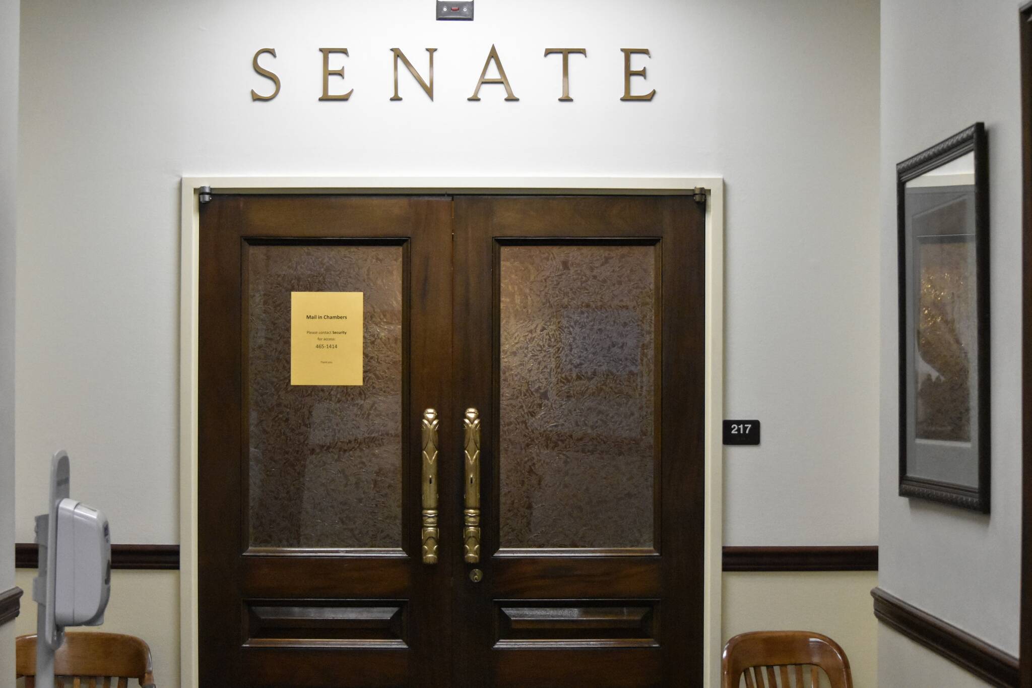 The doors of the Alaska Senate chambers were shut Friday, Oct. 8, 2021, a week into the Alaska State Legislature's fourth special session of the year. Gov. Mike Dunleavy called lawmakers to session to resolve the state's longterm fiscal issues, but the same divisions that have kept lawmakers from finding resolution before are still in place. (Peter Segall / Juneau Empire)
